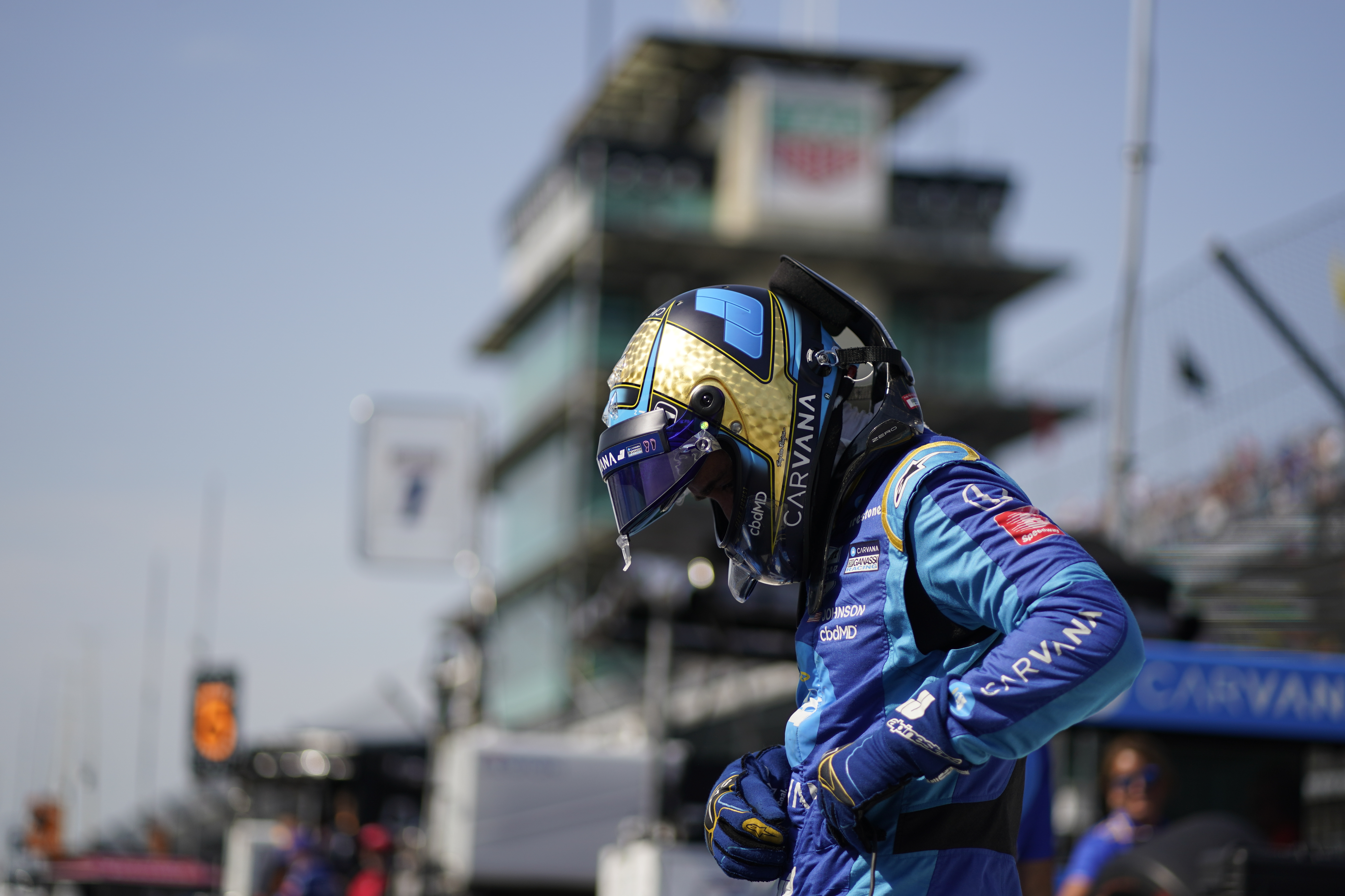 Jimmie Johnson prepares to climb into his car during practice for the Indianapolis 500 auto race at Indianapolis Motor Speedway, Friday, May 20, 2022, in Indianapolis. 