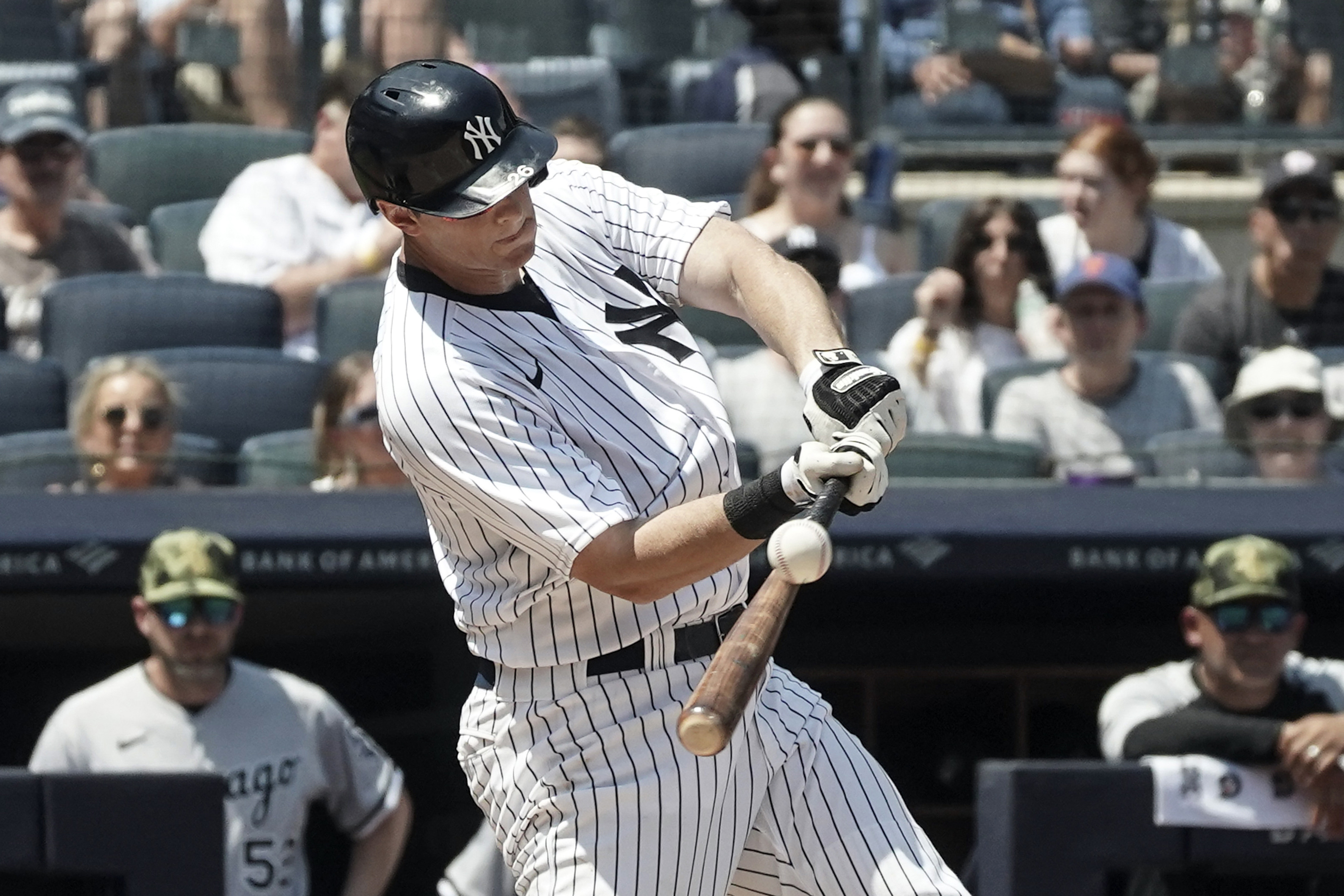 New York Yankees' DJ LeMahieu (26) hits a grand slam during the second inning of a baseball game against Chicago White Sox, Saturday, May 21, 2022, in New York. 