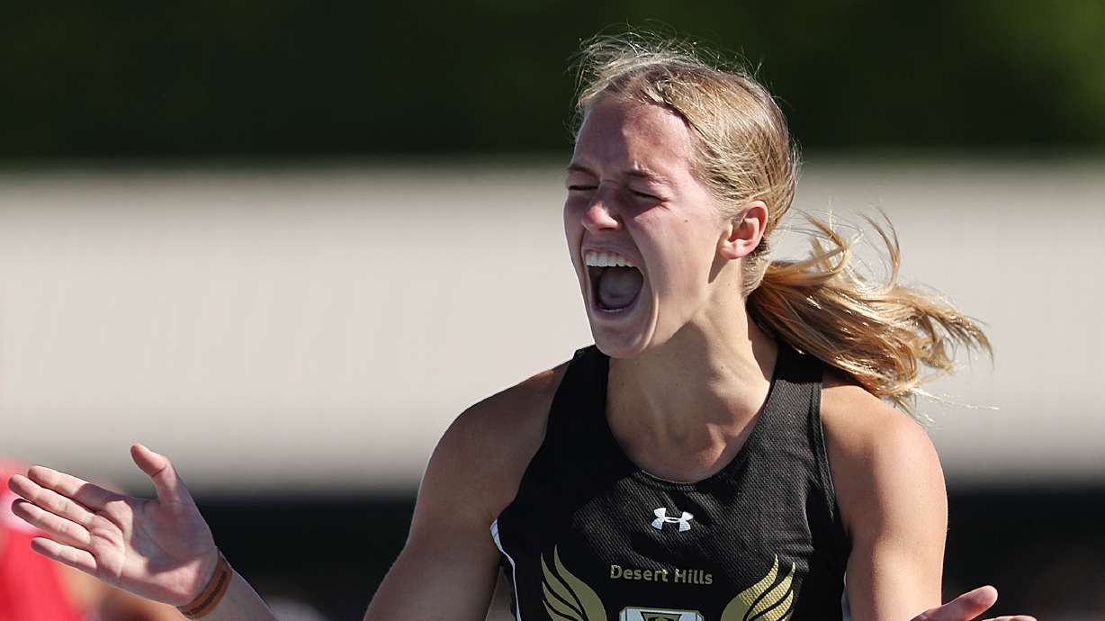 Desert Hills’ Lucy Harris, celebrates her 4A win in the 100 meter hurdles in the High school state championships at BYU in Provo on Saturday, May 21, 2022.