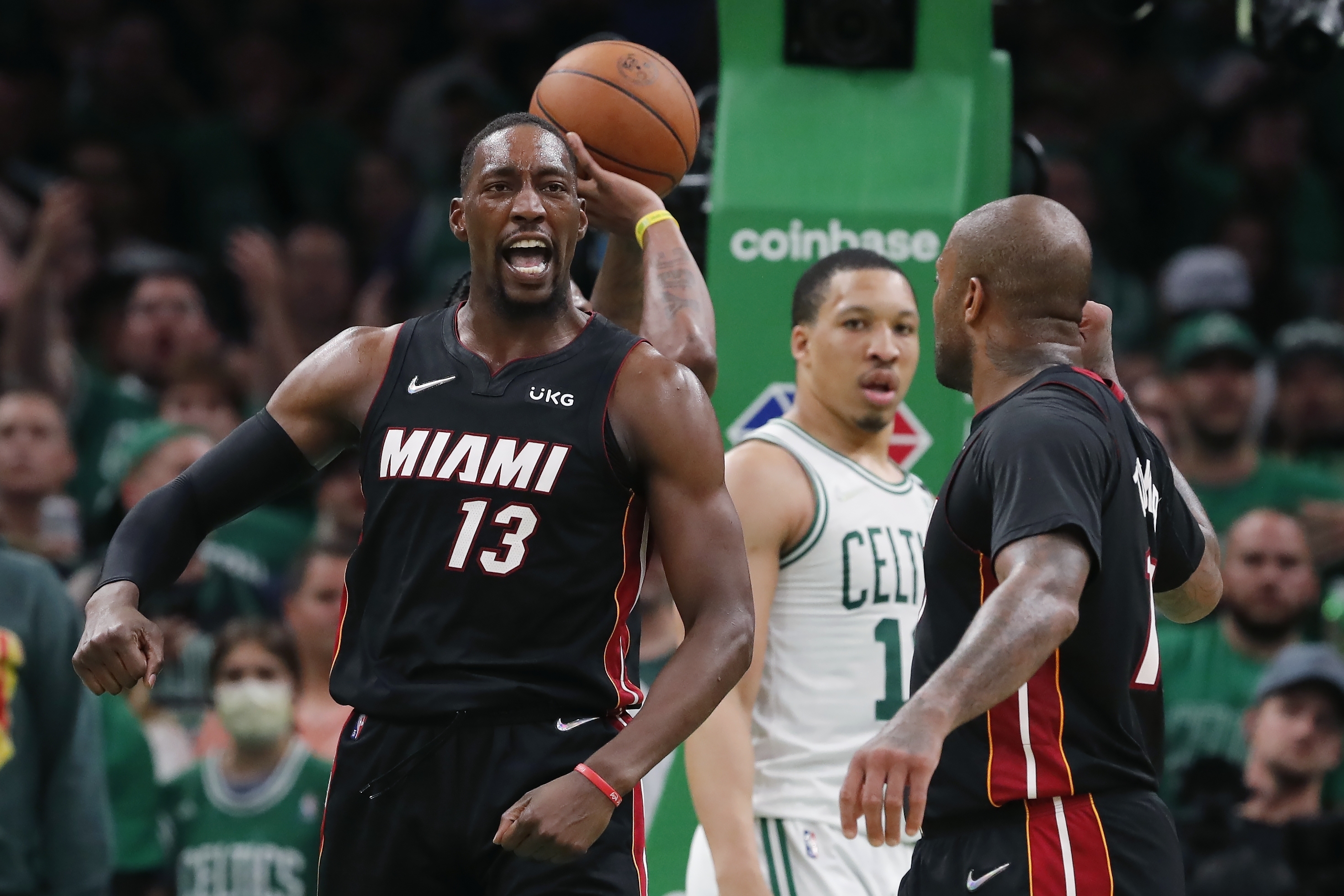 Miami Heat's Bam Adebayo (13) celebrates after scoring against the Boston Celtics during the second half of Game 3 of the NBA basketball playoffs Eastern Conference finals Saturday, May 21, 2022, in Boston. 