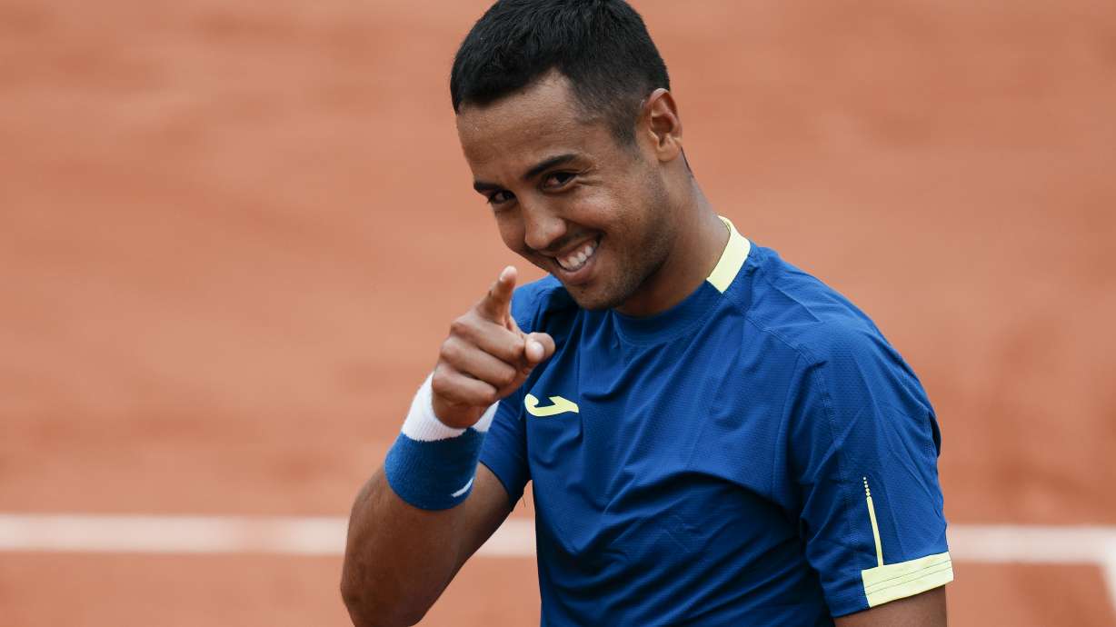 Bolivia's Hugo Dellien celebrates defeating Austria's Dominic Thiem in three sets, 6-3, 6-2, 6-4, in their first round match at the French Open tennis tournament in Roland Garros stadium in Paris, France, Sunday, May 22, 2022.