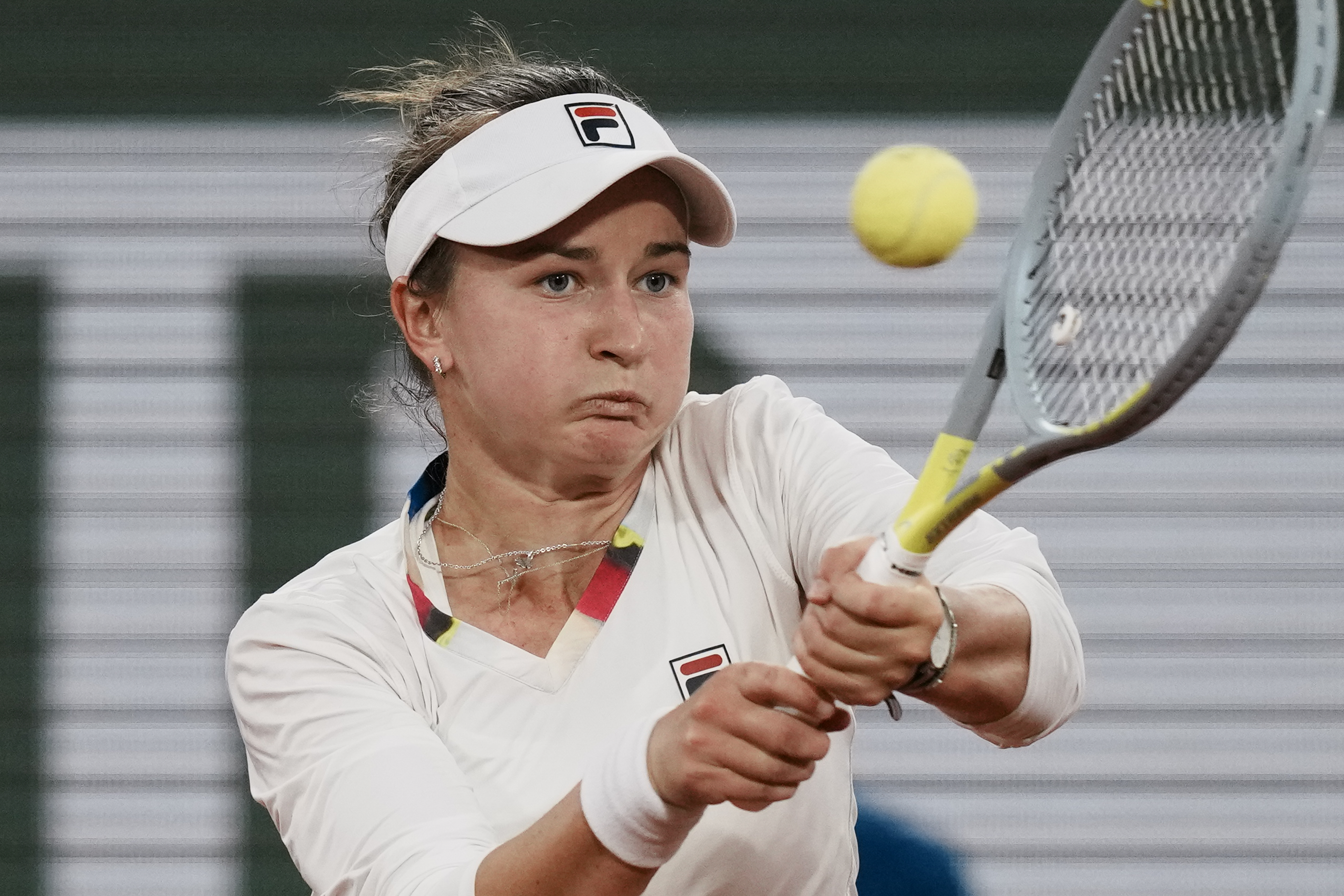 Barbora Krejcikova of the Czech Republic plays a shot against France's Diane Parry during their first round match at the French Open tennis tournament in Roland Garros stadium in Paris, France, Monday, May 23, 2022. 