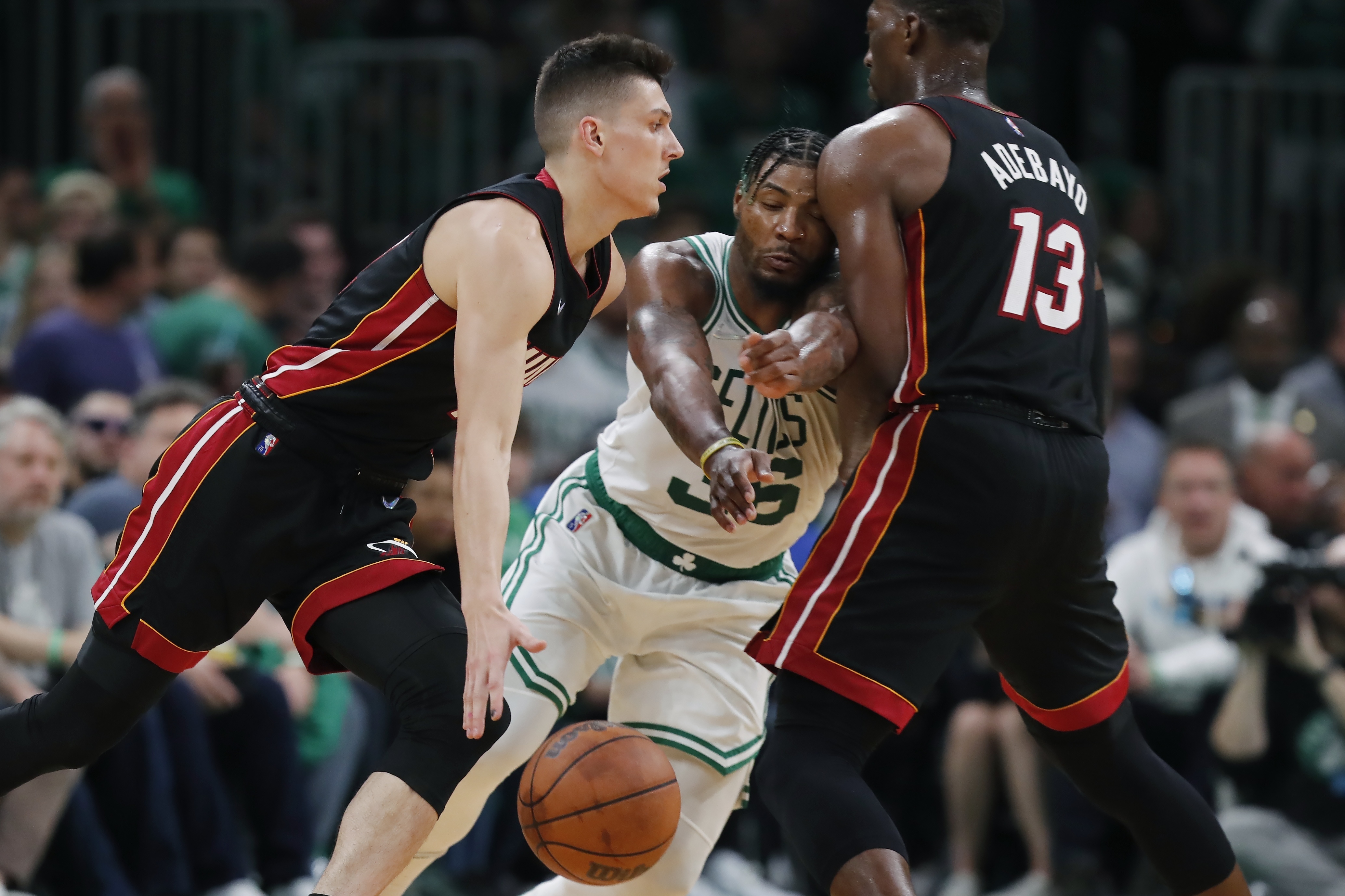 Miami Heat's Bam Adebayo (13) screens Boston Celtics' Marcus Smart (36) as Tyler Herro, left, drives   during the second half of Game 3 of the NBA basketball Eastern Conference finals playoff series, Saturday, May 21, 2022, in Boston. 