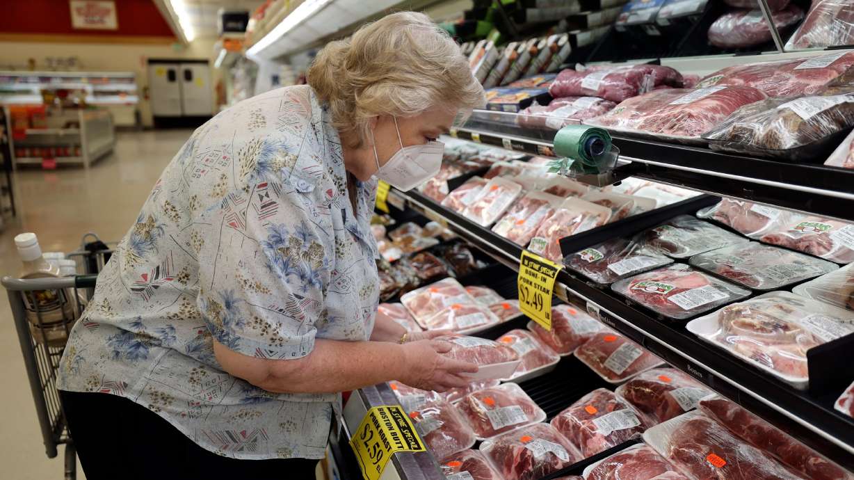Becky Glade shops for meat at a Reams in Sandy on May 18. A new Deseret News/Hinckley Institute of Politics survey finds while almost half of Utahns support the Federal Reserve’s actions to quell inflation, an overwhelming majority believes the strategy will fall short and are concerned an economic recession is still likely to occur in the coming year.