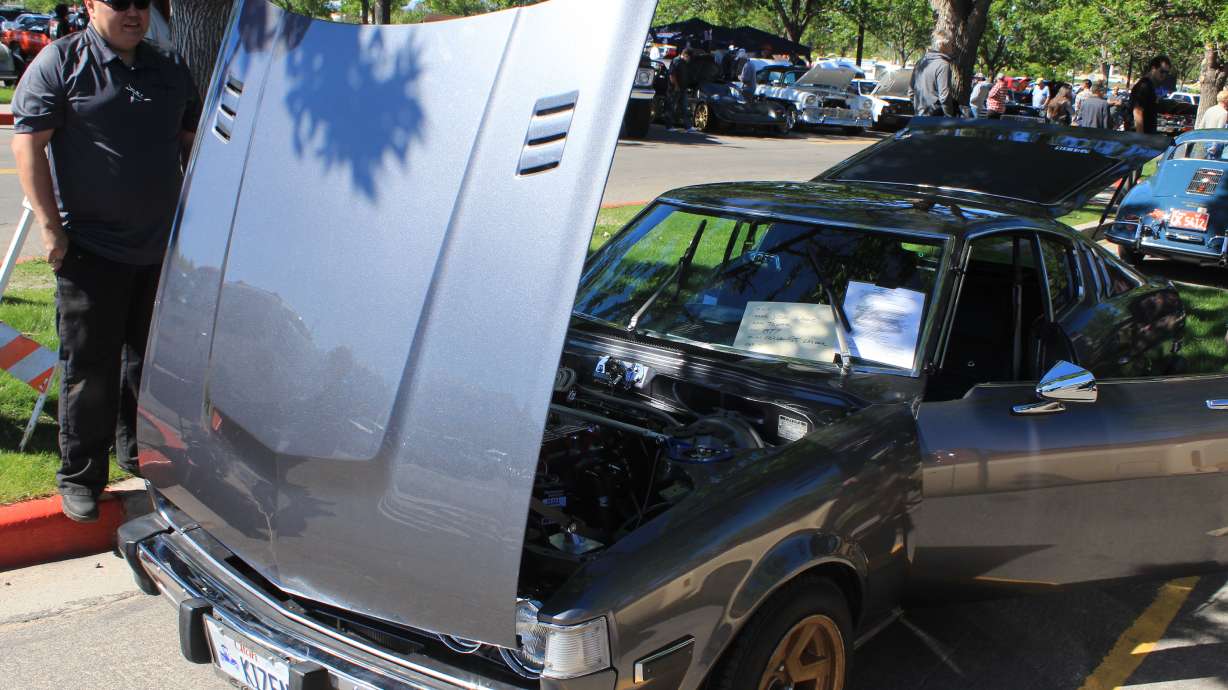 Josh Wheeler shows his 1977 Toyota Celica GT at the Utah Valley University Auto Expo on May 21. When Wheeler first saw a 1977 Toyota Celica, he thought it was a Ford Mustang. He loved the lines so much that he went and found one in 2016, and finished its restoration in 2022.