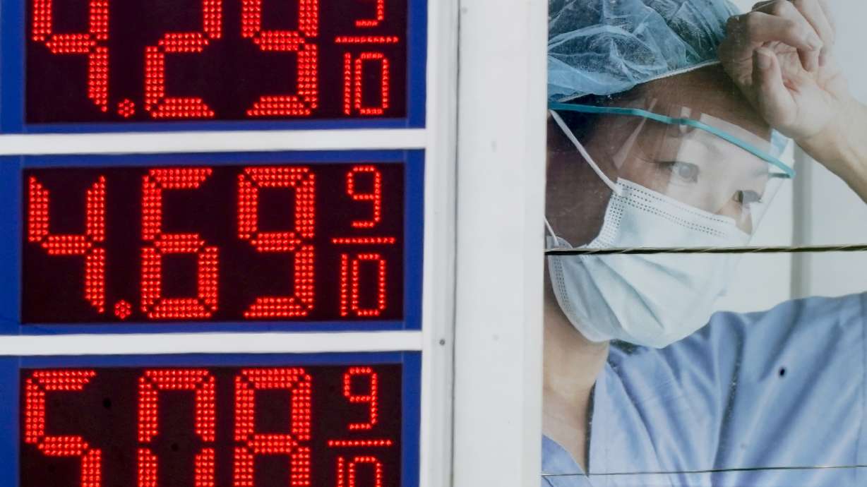 High gas prices are seen in front of a medical billboard on May 11, in Milwaukee, Wisc. Americans are becoming less supportive of punishing Russia for launching its invasion of Ukraine if it comes at the expense of the U.S. economy.