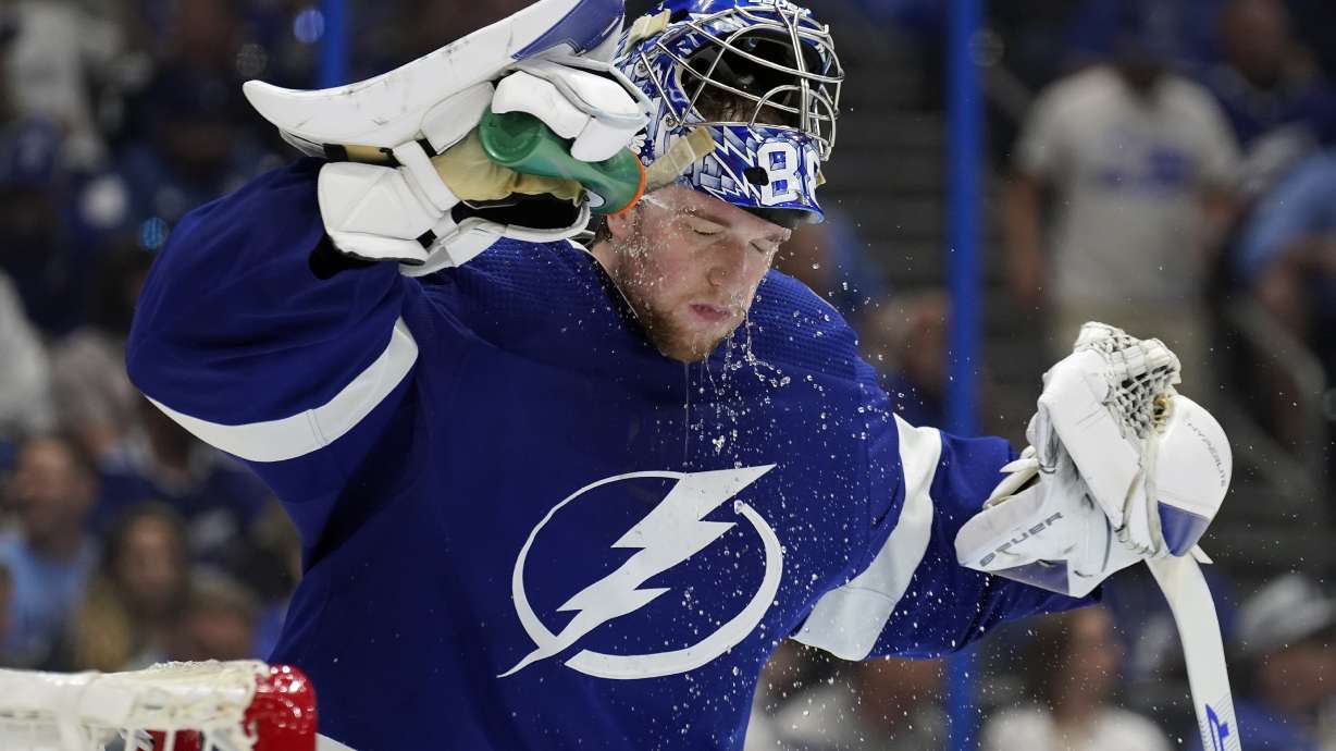 Tampa Bay Lightning goaltender Andrei Vasilevskiy (88) sprays water on his face during a timeout against the Florida Panthers during the third period in Game 4 of an NHL hockey second-round playoff series Monday, May 23, 2022, in Tampa, Fla.