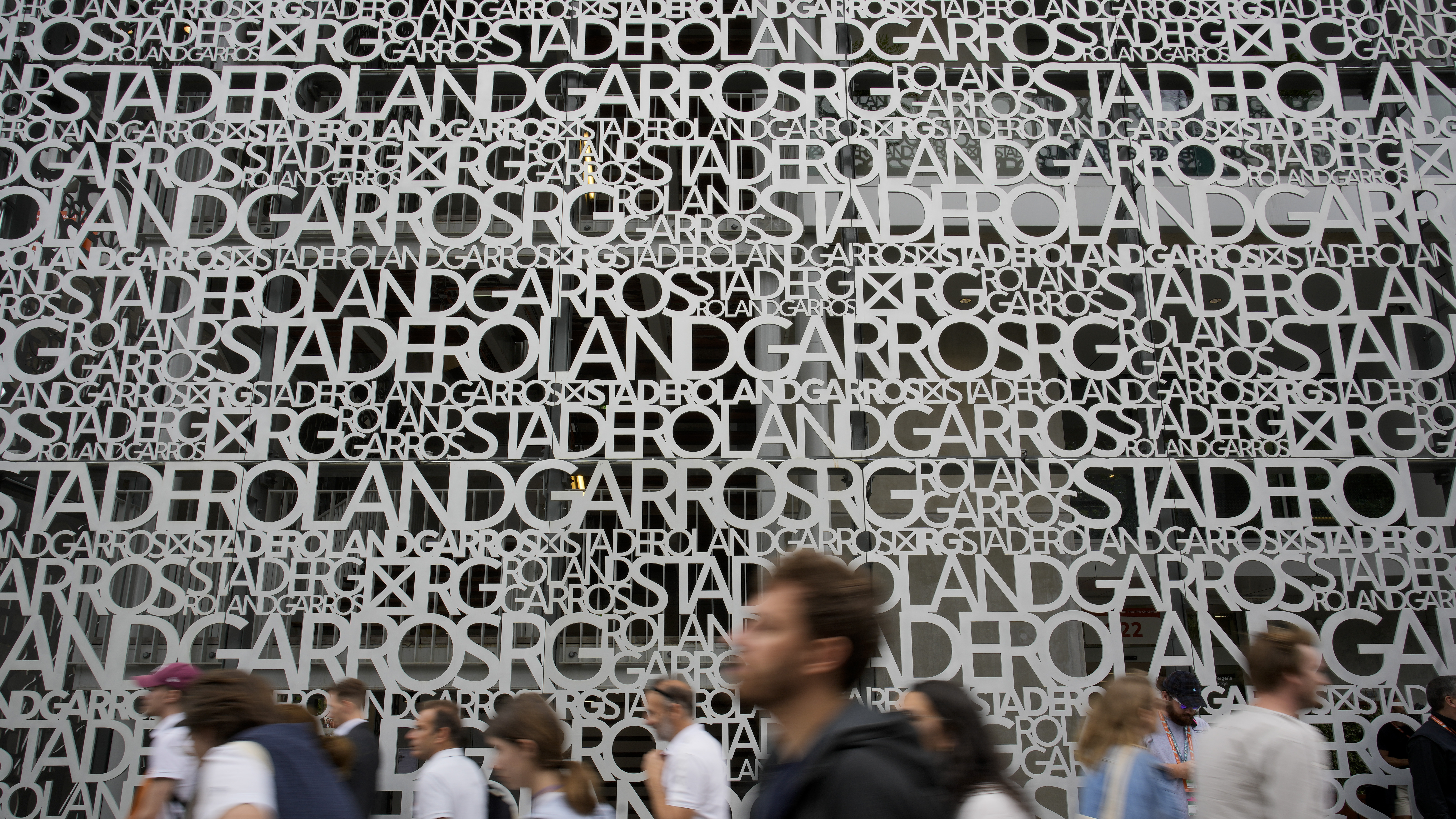 Spectators head to the courts during first round matches at the French Open tennis tournament in Roland Garros stadium in Paris, France, Sunday, May 22, 2022. 