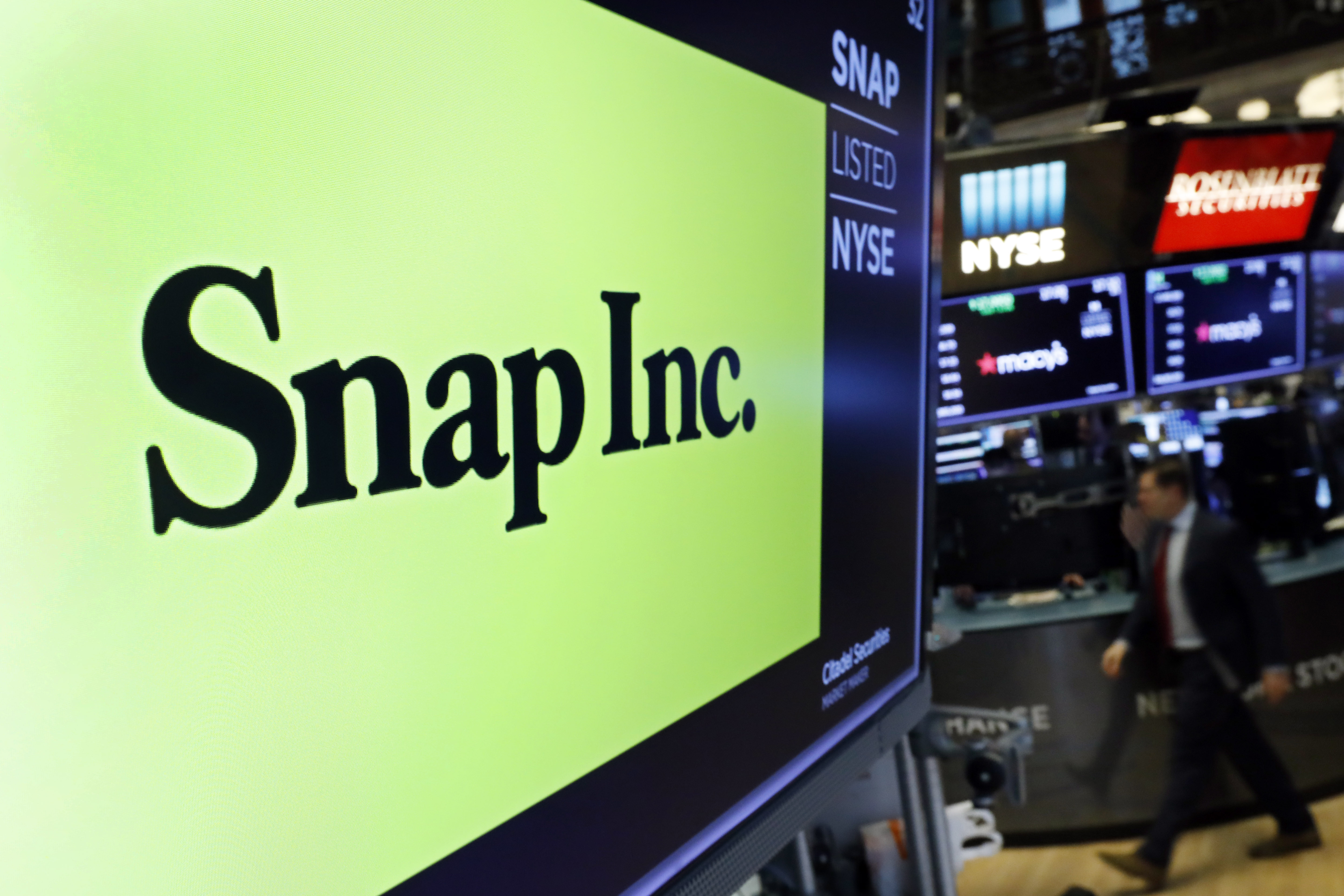 The logo for Snap appears above a post on the floor of the New York Stock Exchange, Feb. 5, 2020. Social media companies are having a tough go of it so far in 2022 as Snap issued a profit warning due to current economic conditions.
