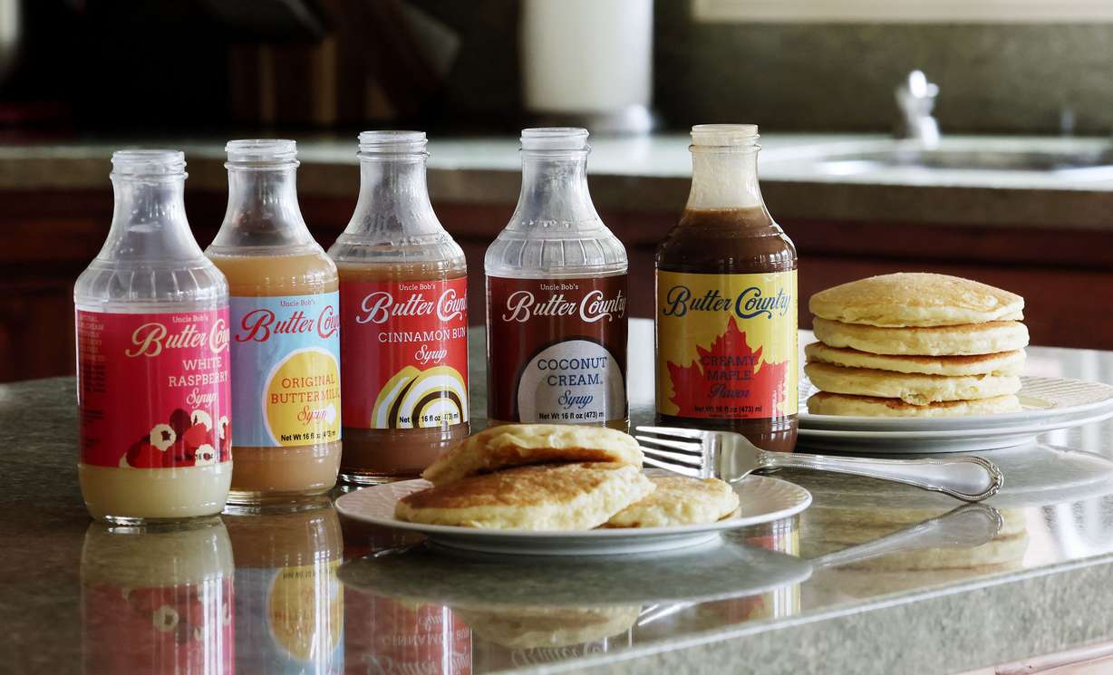 Different flavors of Uncle Bob’s Butter Country Syrup are pictured in Cottonwood Heights on May 9. Bob Smith and son Jared started the company. Flavors range from the original buttermilk to cinnamon bun to coconut cream to harvest spice to creamy maple to white raspberry.