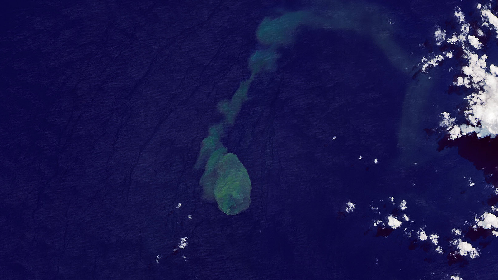 NASA's Earth Observatory has released satellite images of an undersea volcano erupting. This image, from the Operational Land Imager 2 on the Landsat 9 satellite, shows a plume of discolored water being emitted from the submarine volcano.