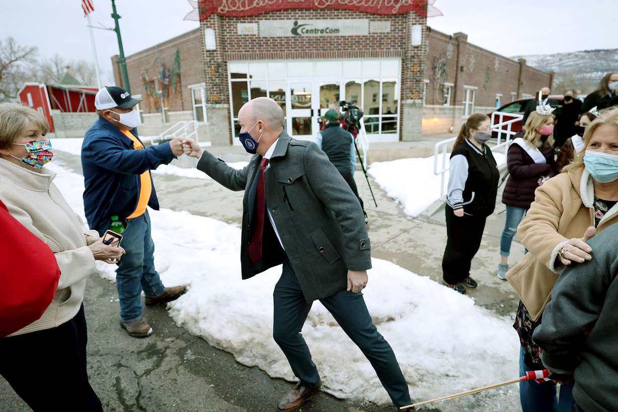 Utah Gov. Spencer Cox talks with friends as he is welcomed back to his hometown of Fairview, Sanpete County, as he and Lt. Gov. Deidre Henderson and their families make their way toward Salt Lake City after the inaugural ceremony earlier in the day at Tuacahn Center for the Arts in Ivins near St. George on Jan. 4, 2021.