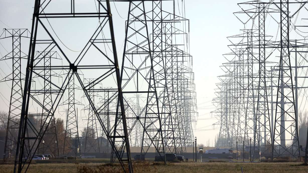 Power lines run through Roy on Nov. 30, 2021. A summer reliability assessment for 2022 puts a huge chunk of the United States at risk for potential grid failure — meaning the lights won't come on and the hum of air conditioners will go silent.