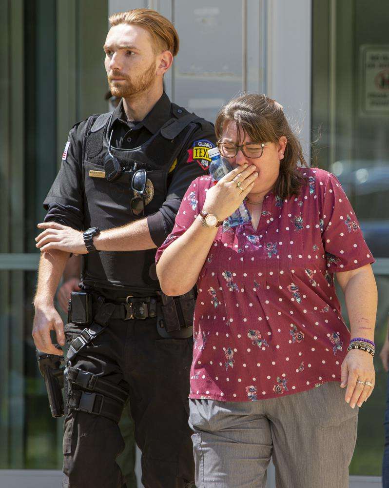 A woman cries as she leave the Uvalde Civic Center following a shooting earlier in the day at Robb Elementary School, Tuesday, in Uvalde, Texas.