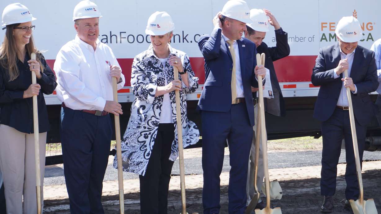 Gov. Spencer Cox and Utah Food Bank president and CEO Ginette Botts participate in the groundbreaking ceremony of Utah Food Bank's new center in Springville on Tuesday.