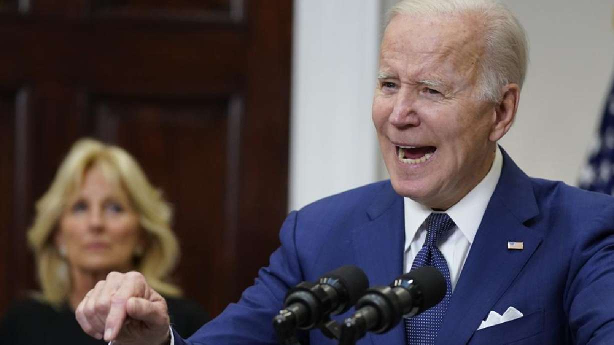 President Joe Biden speaks about the mass shooting at Robb Elementary School in Uvalde, Texas, from the White House, in Washington, Tuesday, as first lady Jill Biden listens. An anguished and angry Biden called for new restrictions on firearms Tuesday night after a gunman massacred 18 children at a Texas elementary school.