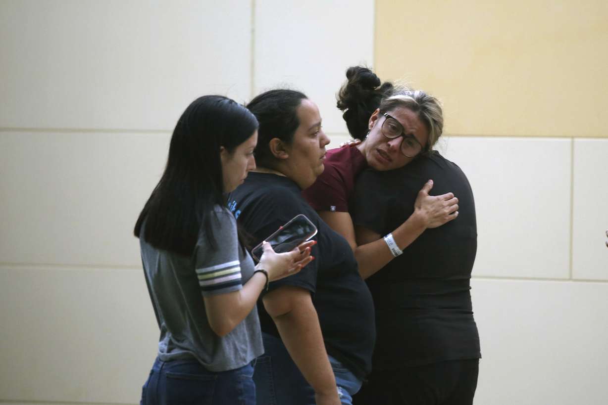 People react outside the Civic Center following a deadly school shooting at Robb Elementary School in Uvalde, Texas Tuesday.