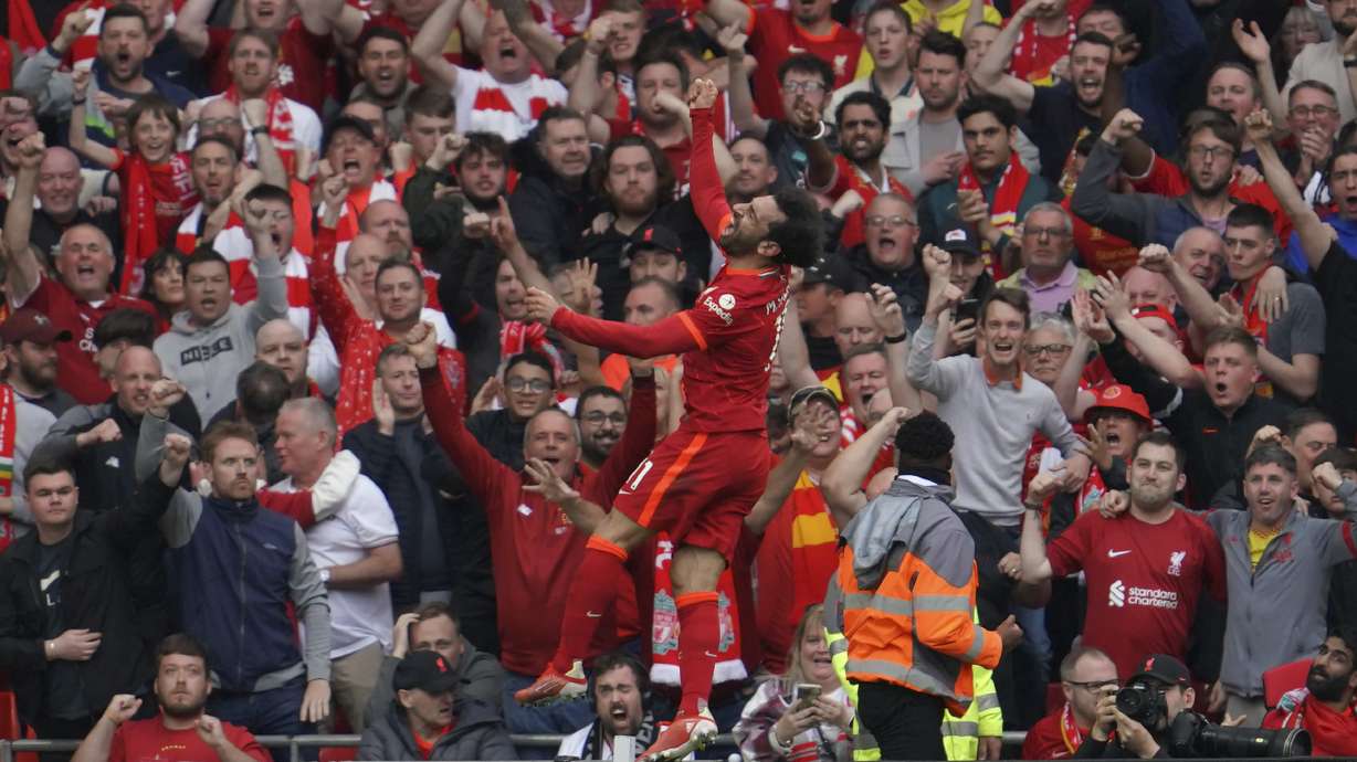 Liverpool's Mohamed Salah celebrates after scoring his goal during the Premier League soccer match between Liverpool and Wolverhampton at Anfield stadium in Liverpool, England, Sunday, May 22, 2022.