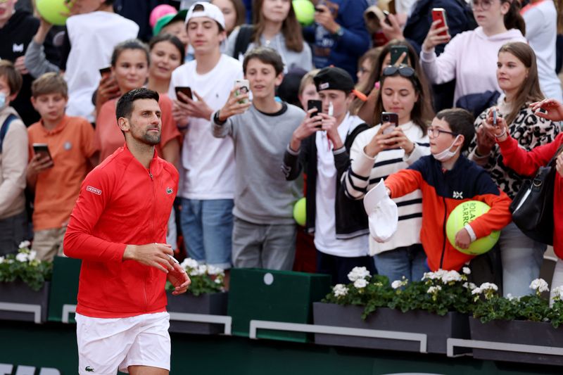 Tennis - French Open - Roland Garros, Paris, France - May 25, 2022 Serbia's Novak Djokovic celebrates winning his second round match against Slovakia's Alex Molcan
