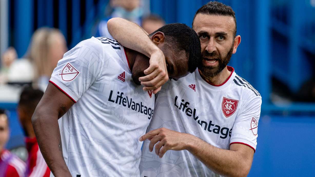 Justin Meram, right, hugs Sergio Cordova after celebrating the latter's game-winner in Montreal.