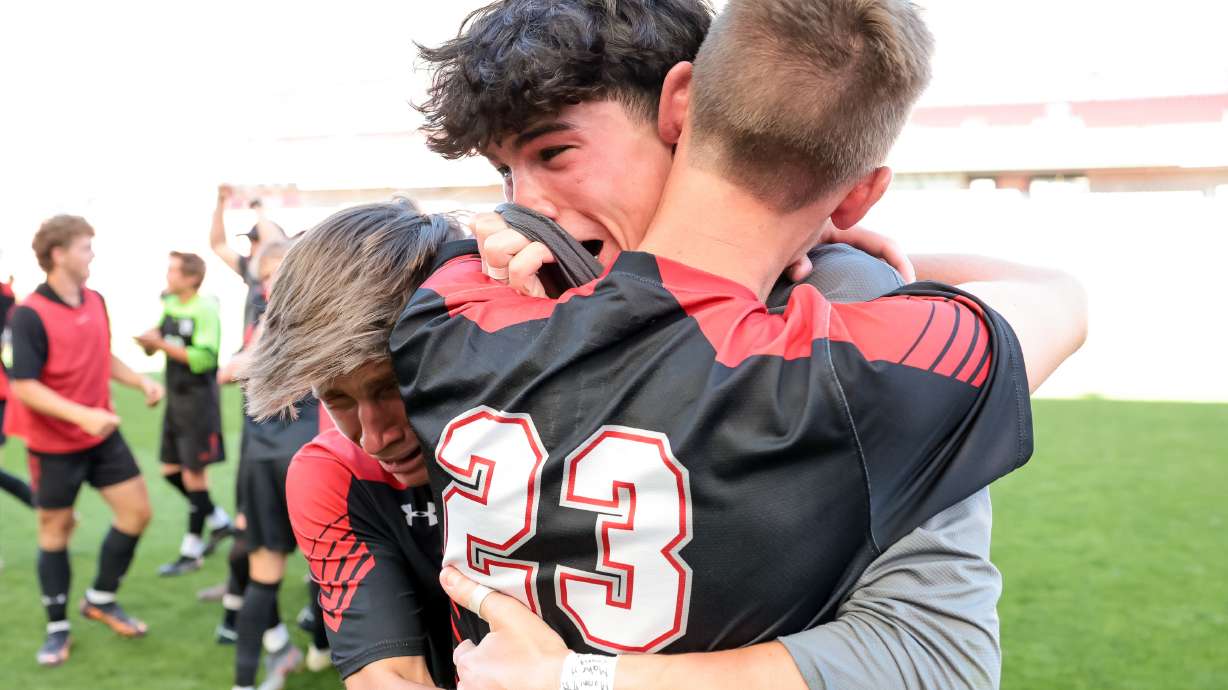 Alta’s Jack Johnson, Thiago Moreira and Adam Rasmussen celebrate after their team beat Lehi in a shootout during the 5A boys soccer state championship at Rio Tinto Stadium in Sandy on Wednesday, May 25, 2022.