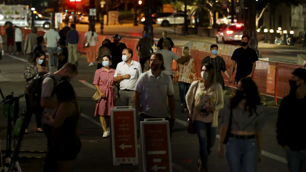 People stroll up Main Street during Downtown SLC Open Streets in Salt Lake City on Friday, Sept. 18, 2020. The Open Streets program returns on Friday for the next few weekends but plans are in place to make the idea more permanent.