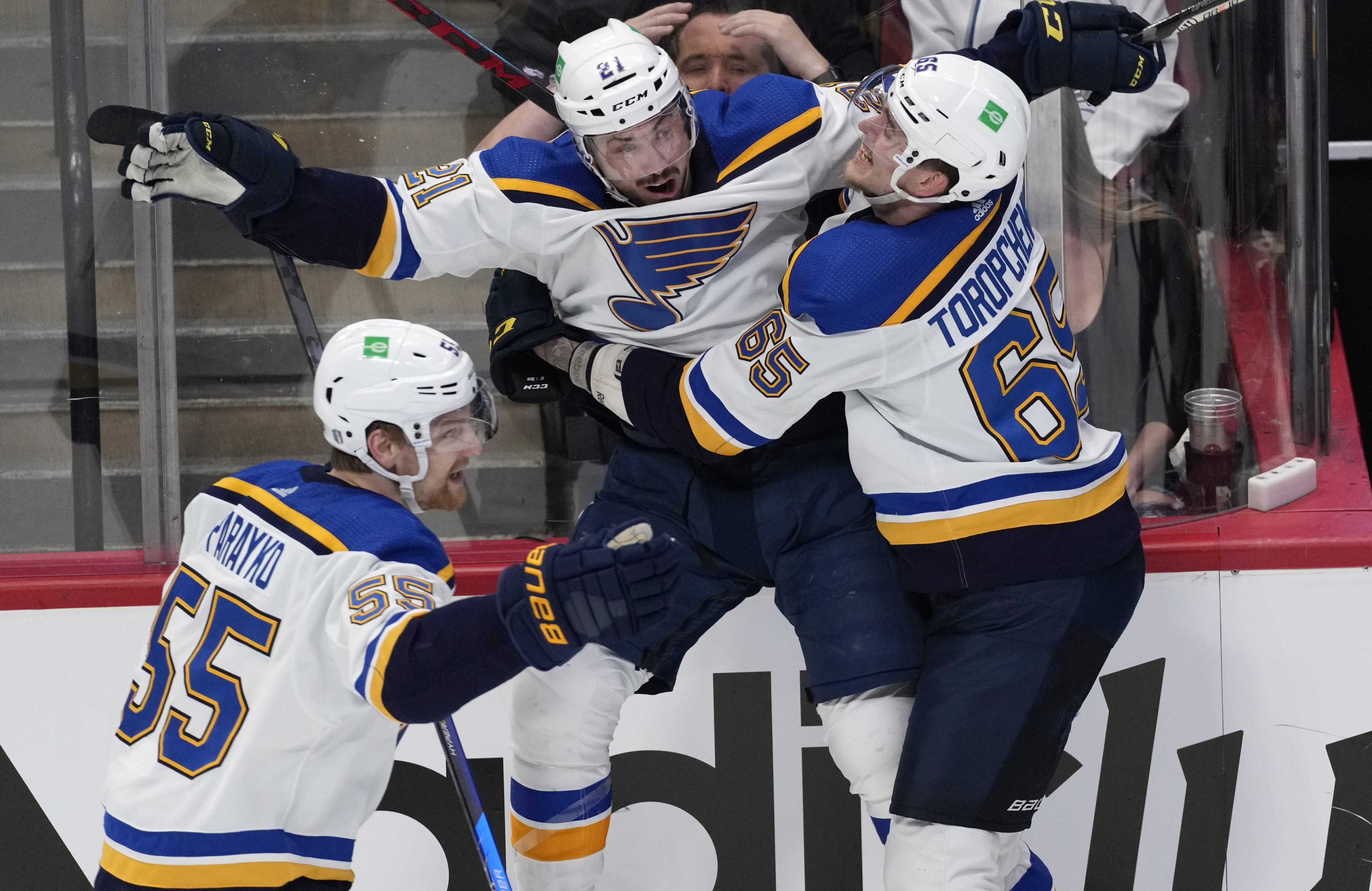 St. Louis Blues center Tyler Bozak, middle, celebrates his overtime goal against the Colorado Avalanche with right wing Alexei Toropchenko in Game 5 of an NHL hockey Stanley Cup second-round playoff series Wednesday, May 25, 2022, in Denver. At left is Colton Parayko. 