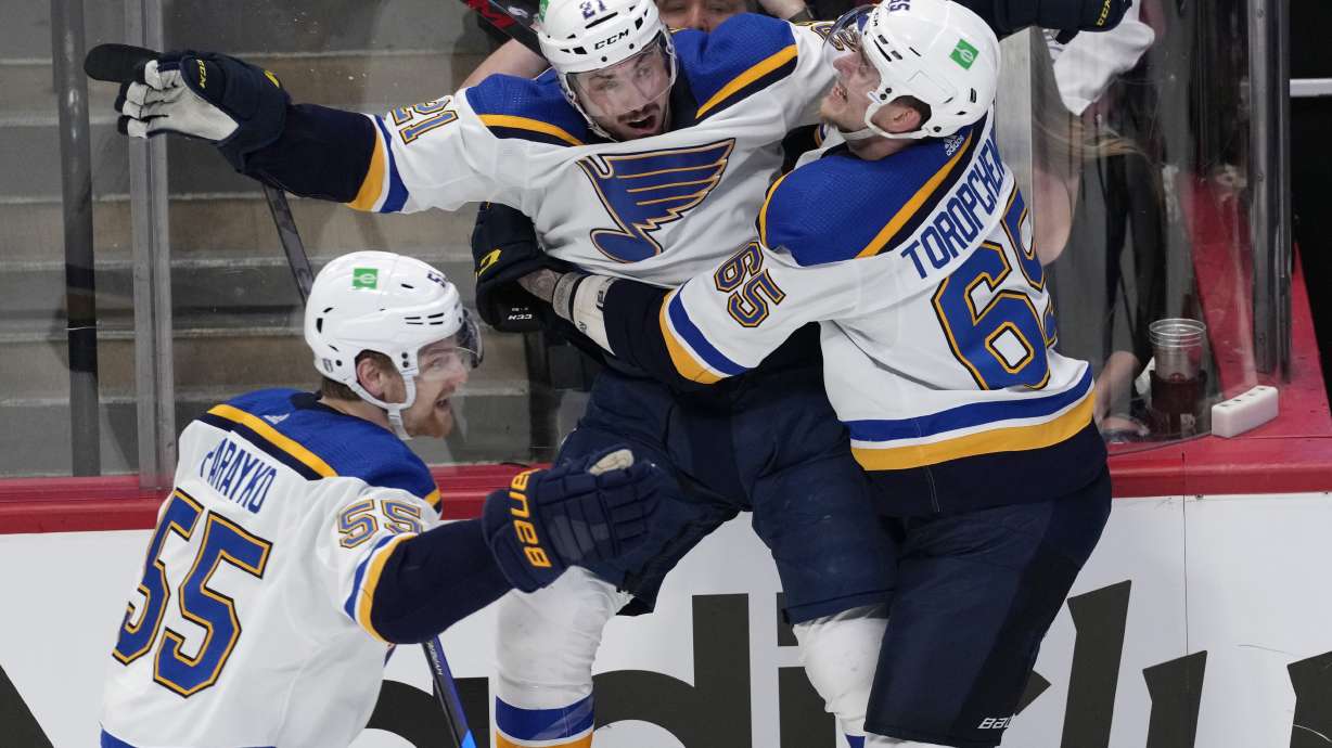 St. Louis Blues center Tyler Bozak, middle, celebrates his overtime goal against the Colorado Avalanche with right wing Alexei Toropchenko in Game 5 of an NHL hockey Stanley Cup second-round playoff series Wednesday, May 25, 2022, in Denver. At left is Colton Parayko.