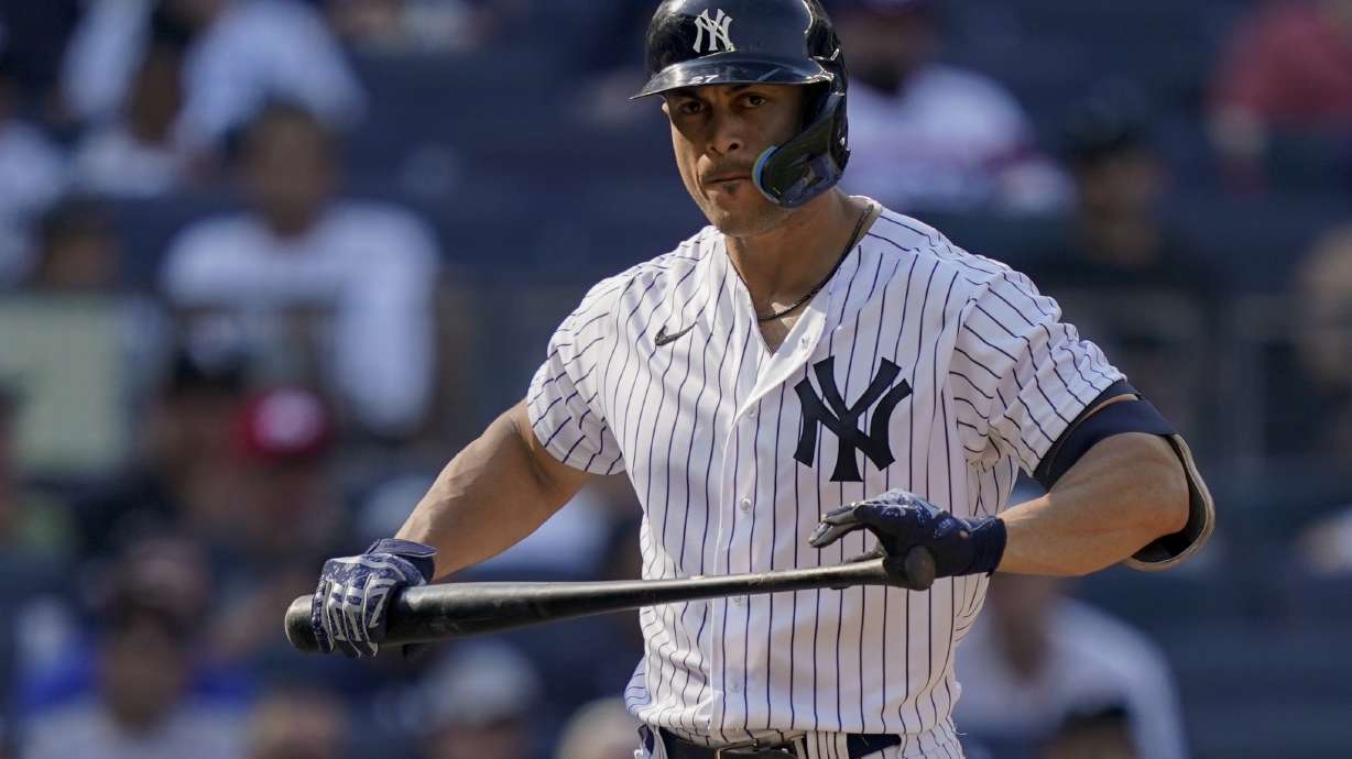 New York Yankees' Giancarlo Stanton reacts after striking out against Chicago White Sox starting pitcher Johnny Cueto (47) in the sixth inning of a baseball game, Sunday, May 22, 2022, in New York.