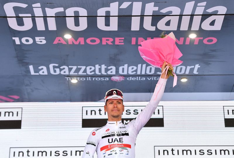FILE PHOTO: Cycling - Giro d'Italia - Stage 17 - Ponte di Legno to Lavarone, Italy - May 25, 2022 UAE Team Emirates' Joao Almeida celebrates wearing the maglia bianca jersey on the podium after Stage 17