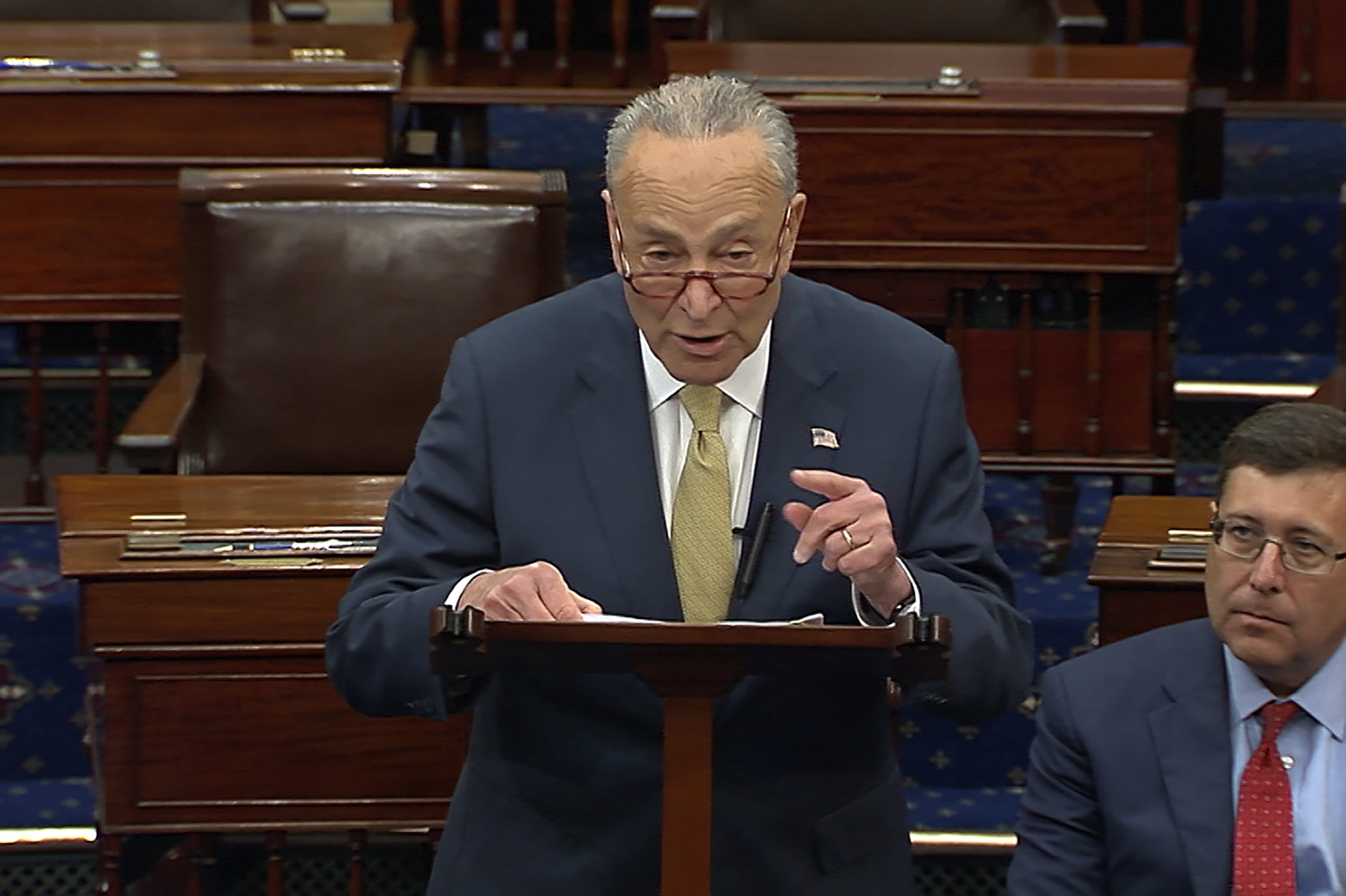 Senate Majority Leader Chuck Schumer of New York, speak on the Senate floor, Wednesday at the Capitol in Washington. Schumer has quickly set in motion a pair of firearms background check bills in response to the school massacre in Texas. 