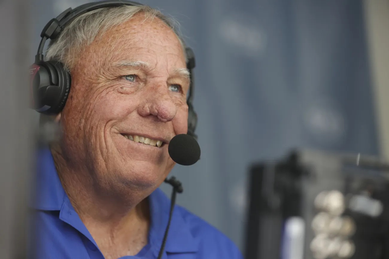 Former BYU football great and current BYUtv baseball and softball analyst Gary Sheide calls a baseball game at Larry H. Miller Field in Provo on Saturday.