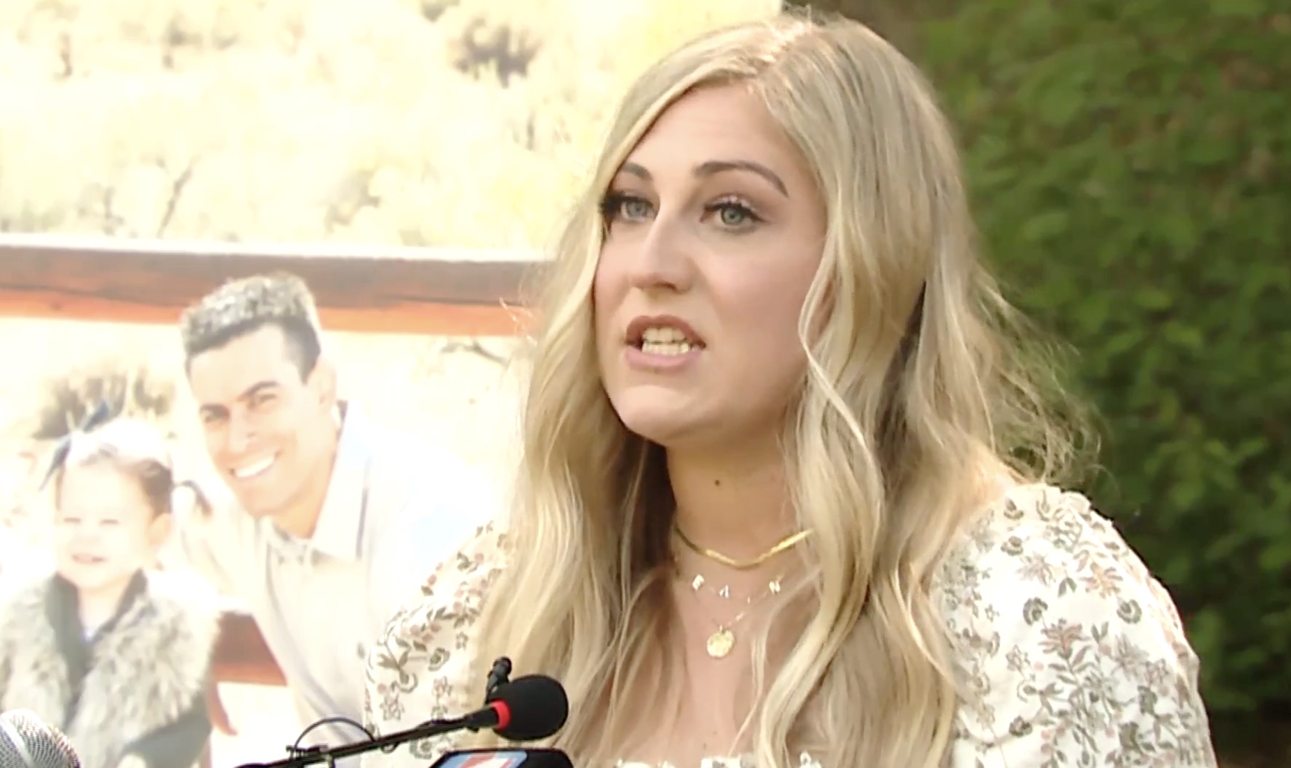 Jordin Petersen Seamons stands in front of a photo of her husband, Devin, who died in a 2018 car crash during a press briefing Thursday at Memory Grove in Salt Lake City. 
