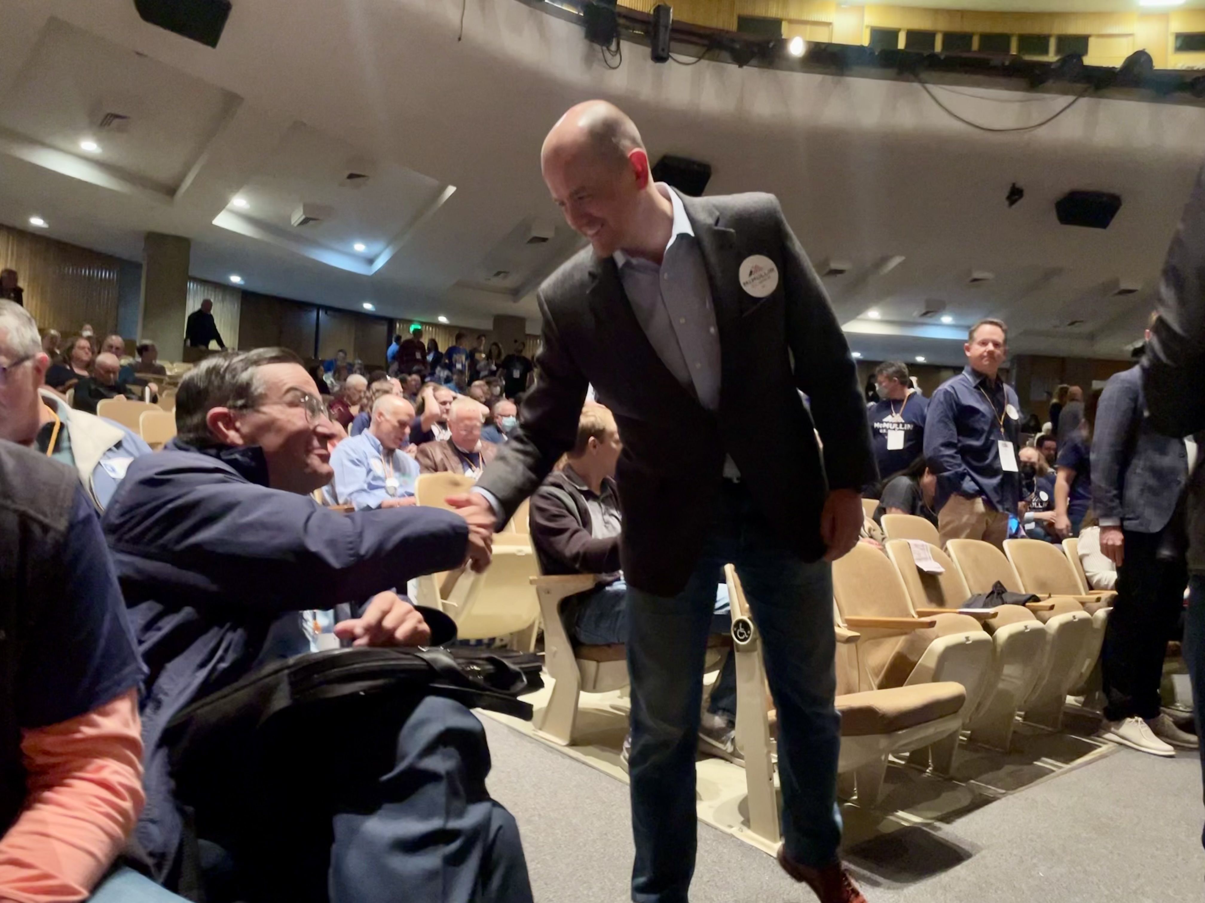 Independent Senate candidate Evan McMullin shakes hands with delegates at the Utah Democratic Party convention on April 23 at Cottonwood High School in Murray. McMullin is running for Sen. Mike Lee’s seat as an independent.