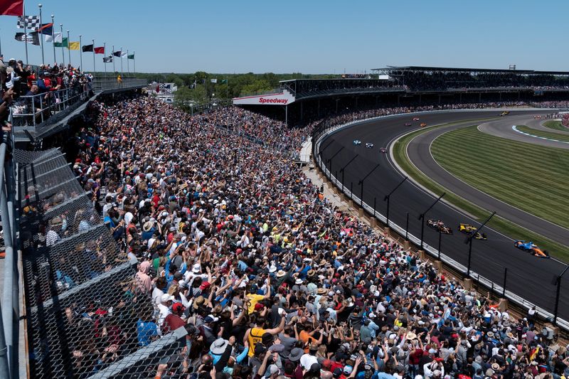 FILE PHOTO: Spectators react as drivers take their first lap at the Indy 500, the largest attended sporting event in the world since the start of the coronavirus disease (COVID-19) pandemic, in Indianapolis, Indiana, U.S., May 30, 2021.