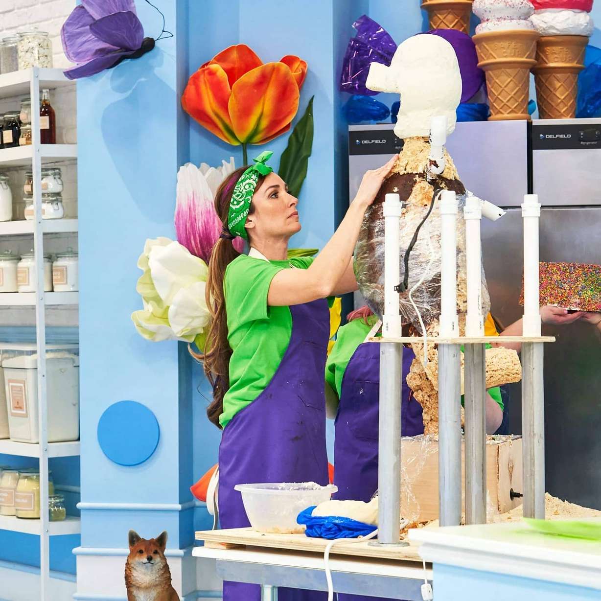 Mandy Clifford works to mold the body of a pig which will soon be part of a giant cake she and her team are making on Food Network Canada's "The Big Bake."