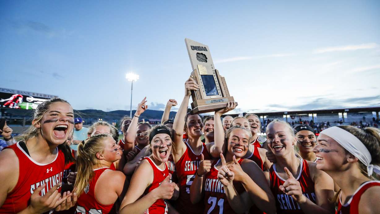 Mountain Ridge hoists the Utah 6A Girls Lacrosse State Championship trophy after defeating Skyridge at Zions Bank Stadium in Herriman, Utah on Saturday, April 23, 2022.