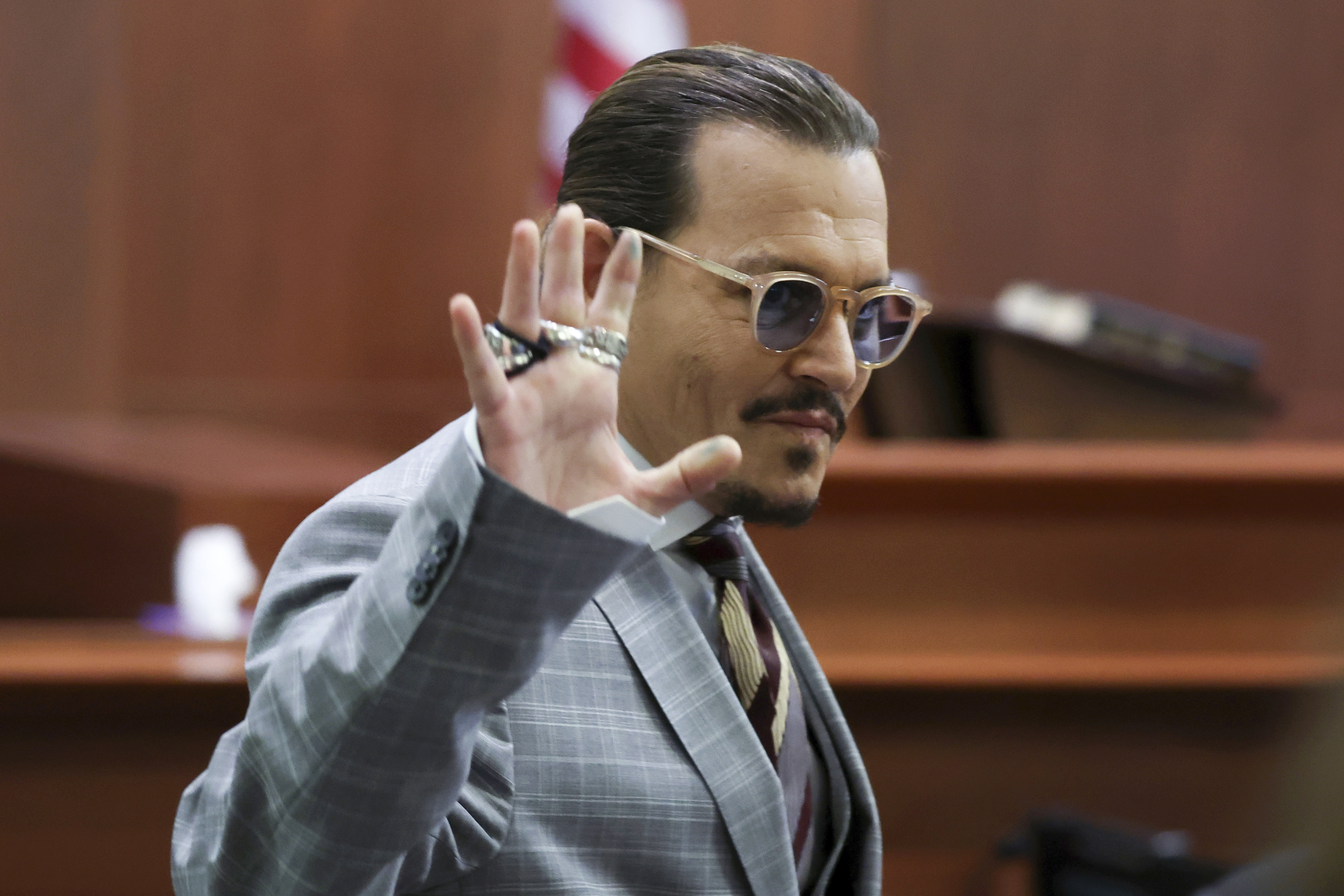 Actor Johnny Depp reacts as he leaves for a break in the courtroom in the Fairfax County Circuit Courthouse in Fairfax, Va., Thursday. Depp sued his ex-wife Amber Heard for libel in Fairfax County Circuit Court after she wrote an op-ed piece in The Washington Post in 2018 referring to herself as a "public figure representing domestic abuse."