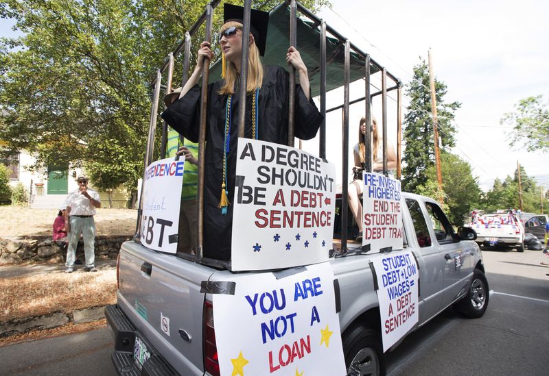 Parade participants protesting against high student loan burdens at Ashland, Oregon, on July 4, 2015. President Joe Biden's administration has not made a final decision on student loan cancellation, a White House spokesperson said on Friday.