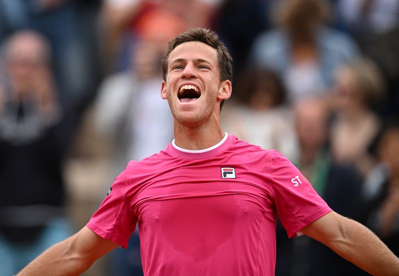 Tennis - French Open - Roland Garros, Paris, France - May 27, 2022 Argentina's Diego Sebastian Schwartzman celebrates after winning his third round match against Bulgaria's Grigor Dimitrov
