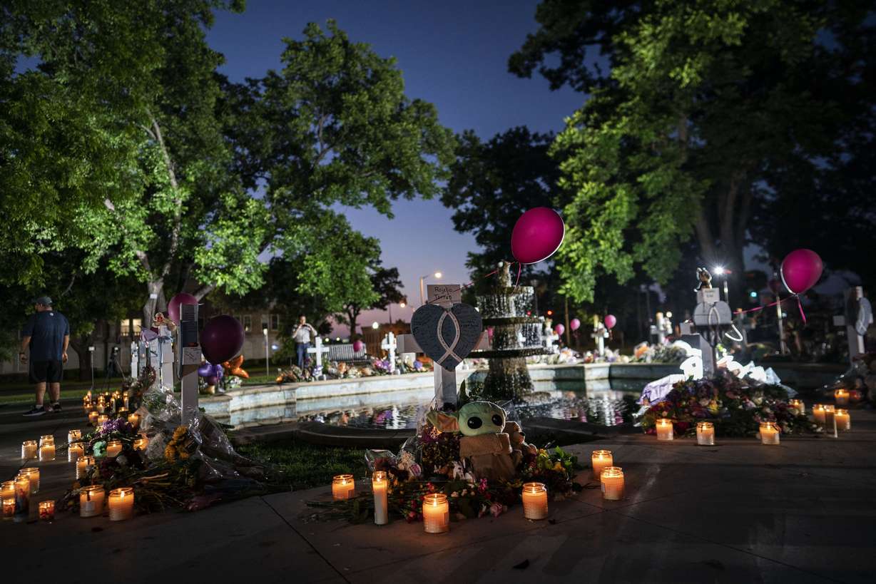 Candles are lit at dawn at a memorial site in the town square for the victims killed in this week's elementary school shooting on Friday in Uvalde, Texas.