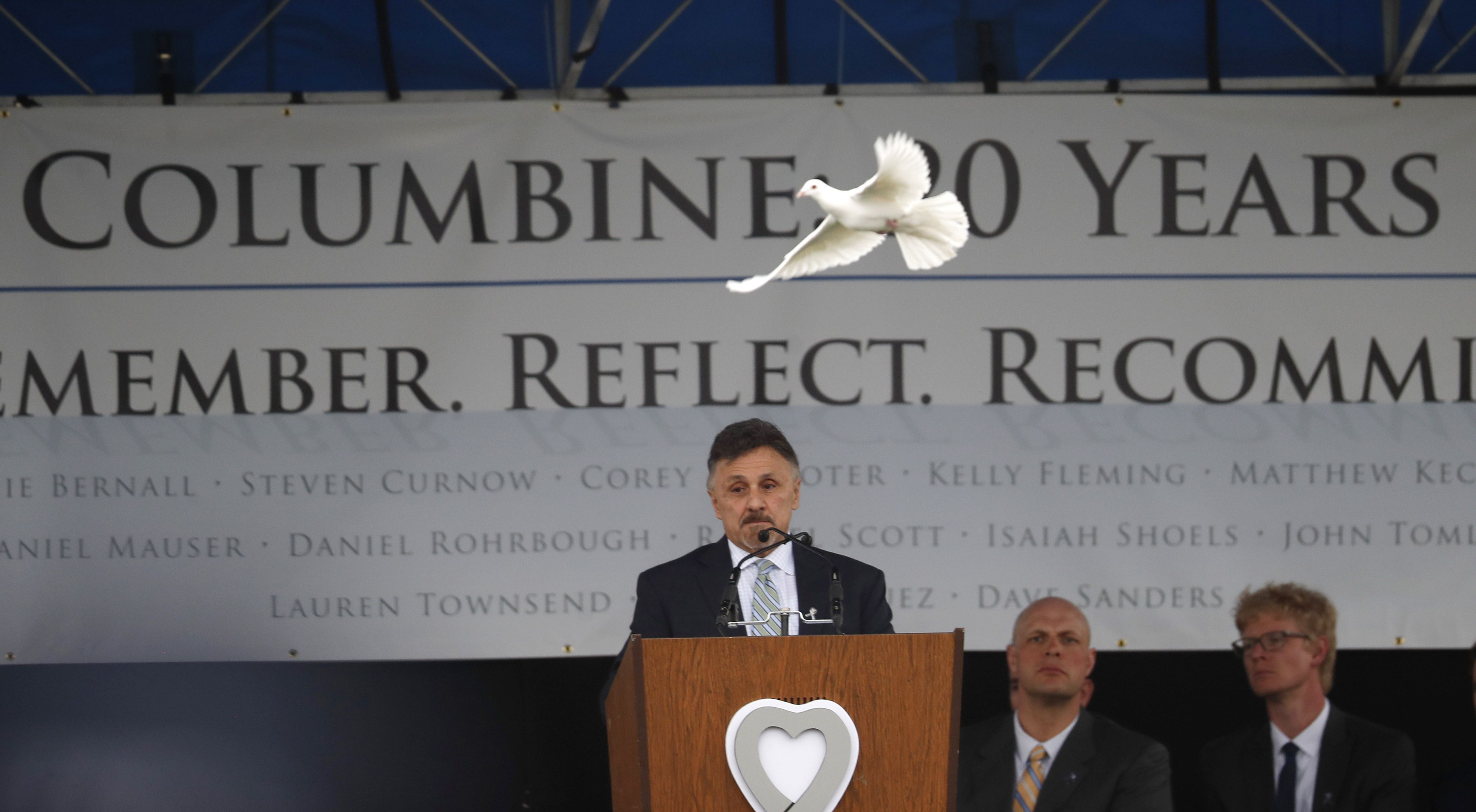 A dove flies over Frank DeAngelis, who was principal of Columbine High School during the attack 20 years ago, during a program for the victims of the massacre April 20, 2019, in Littleton, Colo. Twenty-one principals who have experienced gun violence tragedies at their schools called on elected officials “to do everything it takes to prevent our kids and educators from being murdered in school.”