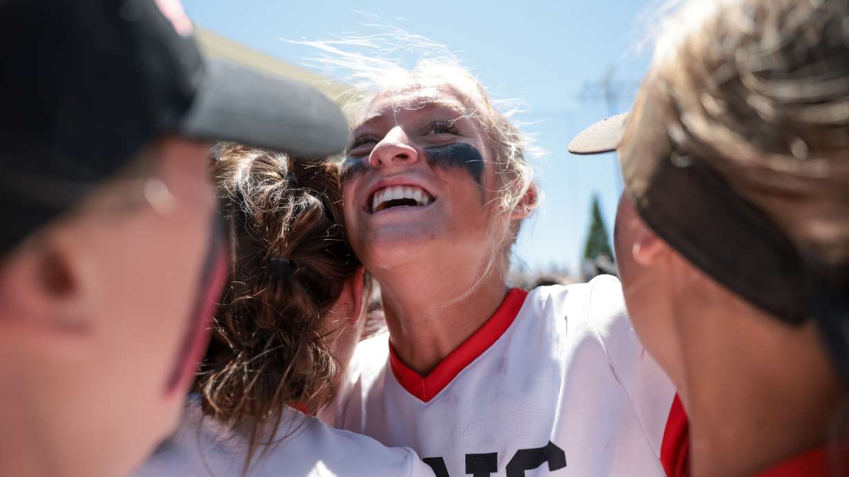Spanish Fork pitcher Avery Sapp and teammates celebrate their win over Lehi in the 5A softball state championship at Miller Park in Provo on Friday, May 27, 2022.