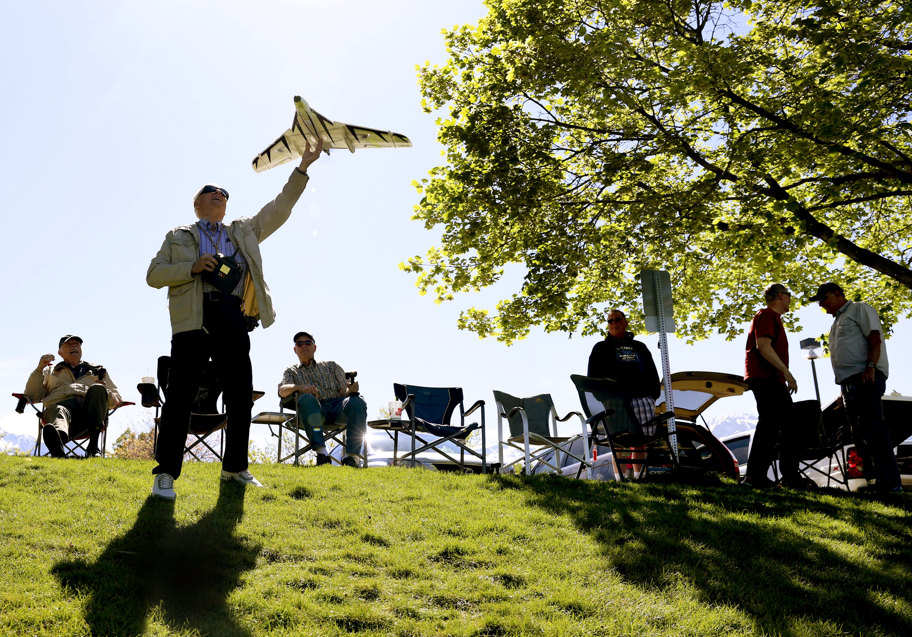 Courtland Cottrell flies his remote control airplane at Falcon Park in Sandy on May 25. Every morning for the past 20 years or so, "The Falcon Park Flyers" get together to tell jokes, laugh, and of course, race their toys.