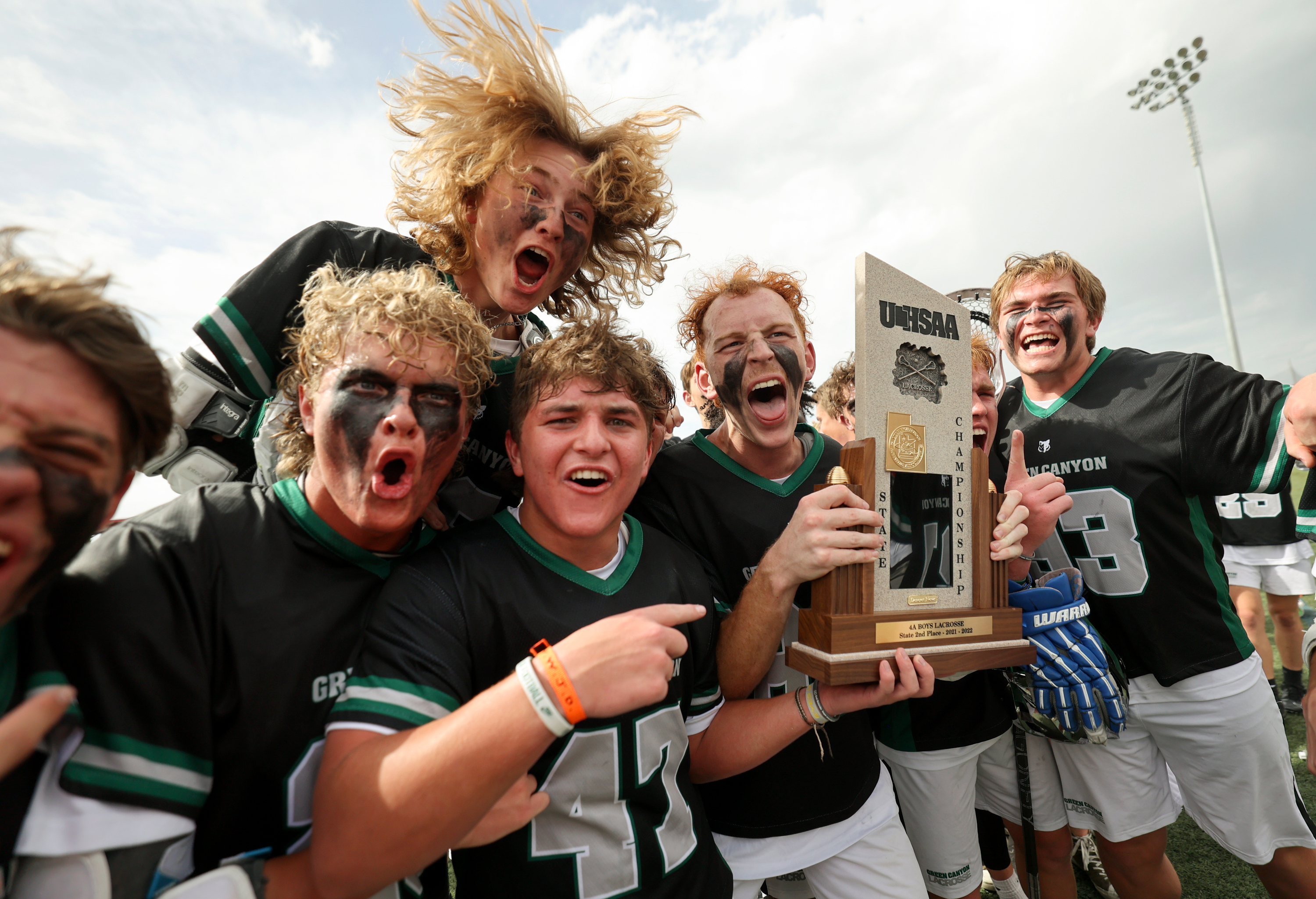 Green Canyon players celebrate after an overtime win over Sky View in the 4A boys lacrosse state championship game at Zions Bank Stadium in Herriman on Friday, May 27, 2022. Green Canyon won in overtime 9-8.