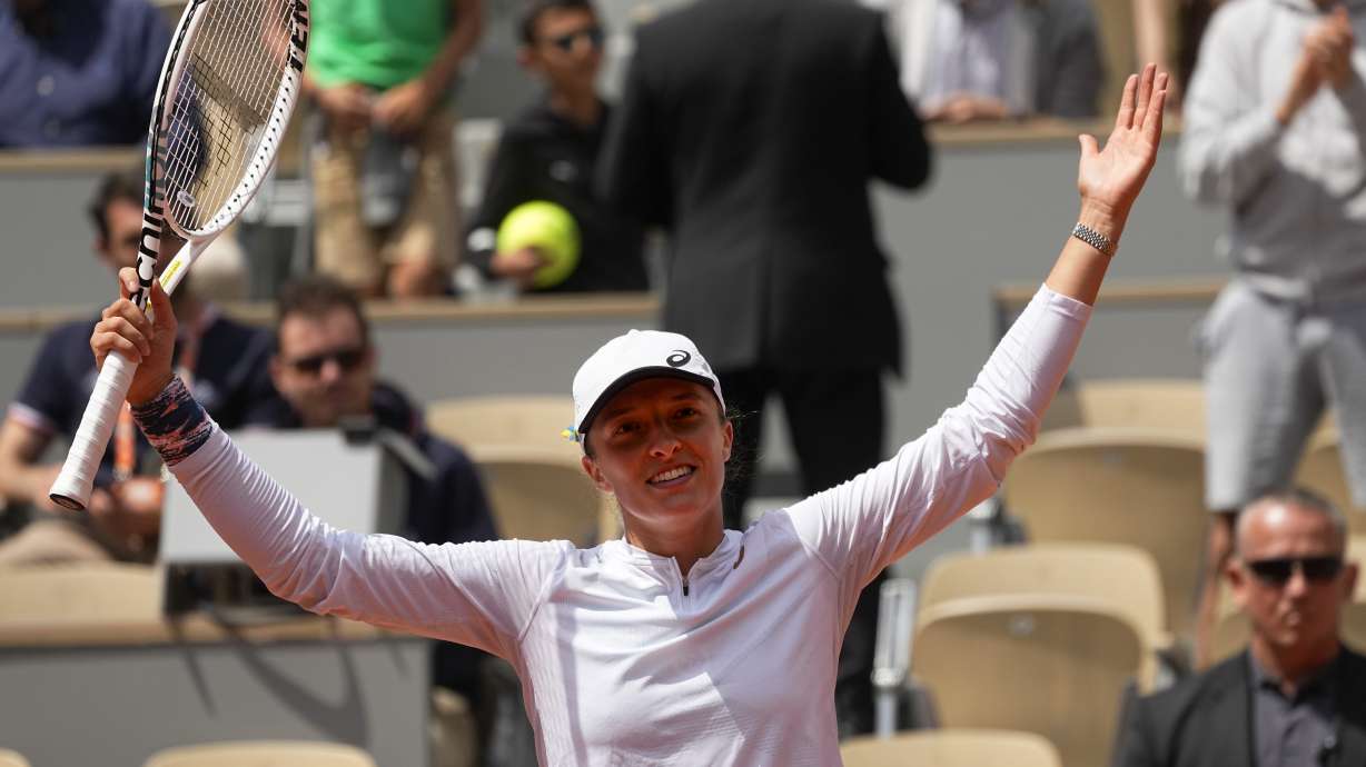 Poland's Iga Swiatek celebrates winning her third round match Montenegro's Danka Kovinic in two sets, 6-3, 7-5, at the French Open tennis tournament in Roland Garros stadium in Paris, France, Saturday, May 28, 2022.