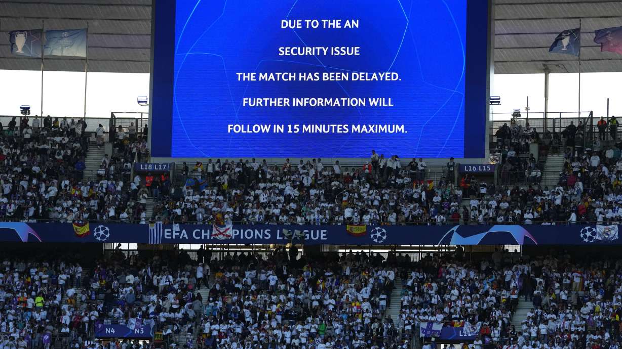 The display announces delay of the Champions League final soccer match between Liverpool and Real Madrid at the Stade de France in Saint Denis near Paris, Saturday, May 28, 2022.