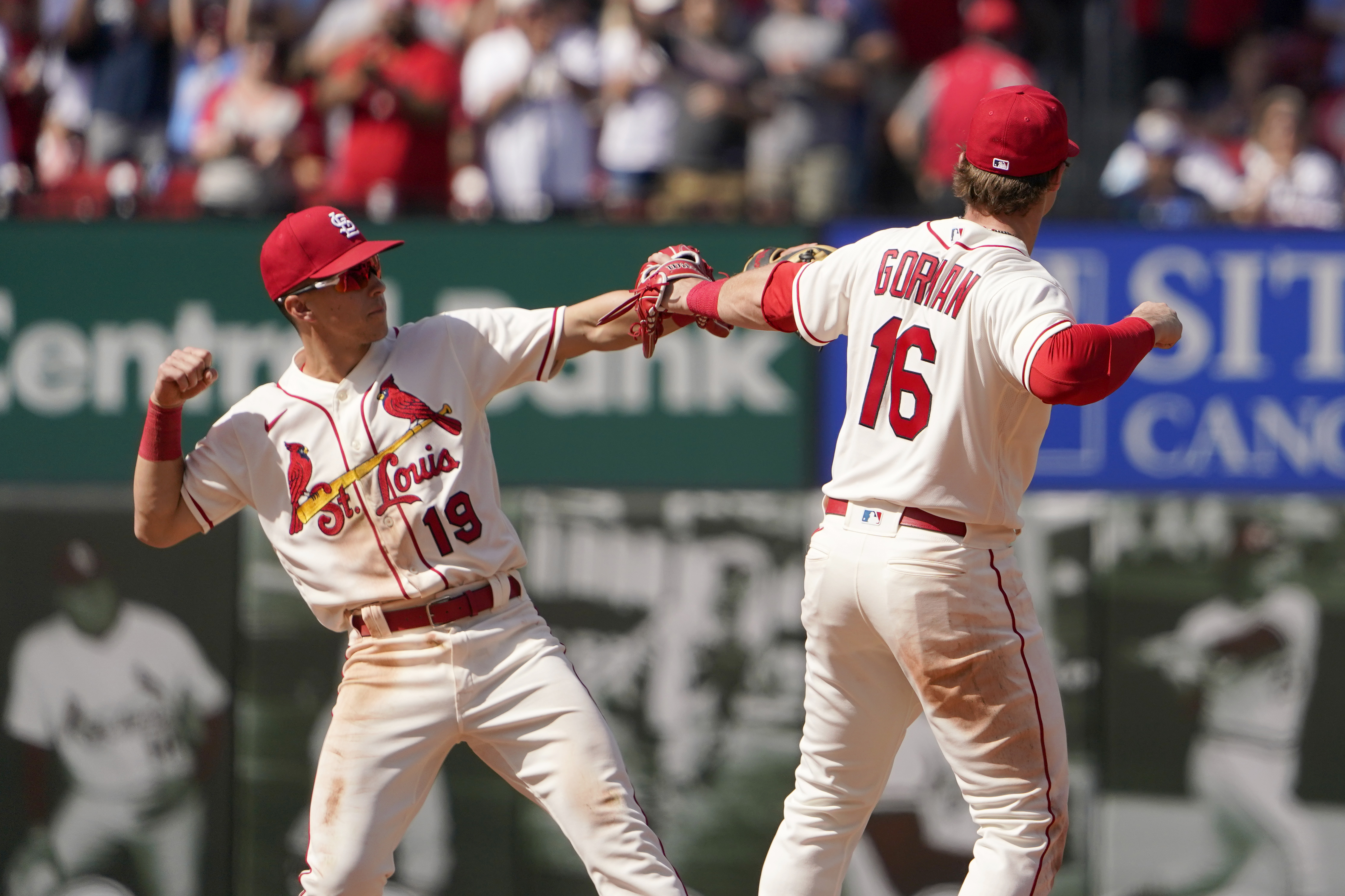 St. Louis Cardinals' Nolan Gorman (16) and Tommy Edman (19) celebrate an 8-3 victory over the Milwaukee Brewers in a baseball game Saturday, May 28, 2022, in St. Louis. 