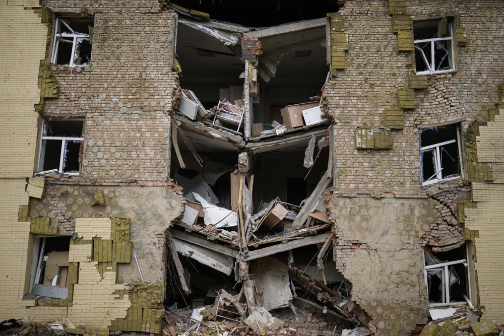 Debris hangs from a residential building heavily damaged in a Russian bombing in Bakhmut, eastern Ukraine, eastern Ukraine, Saturday. Fighting has raged around Lysychansk and neighbouring Sievierodonetsk, the last major cities under Ukrainian control in Luhansk region. After failing to occupy Ukraine's capital, Russia set out to seize the last parts of the eastern region not controlled by Kremlin-backed separatists.