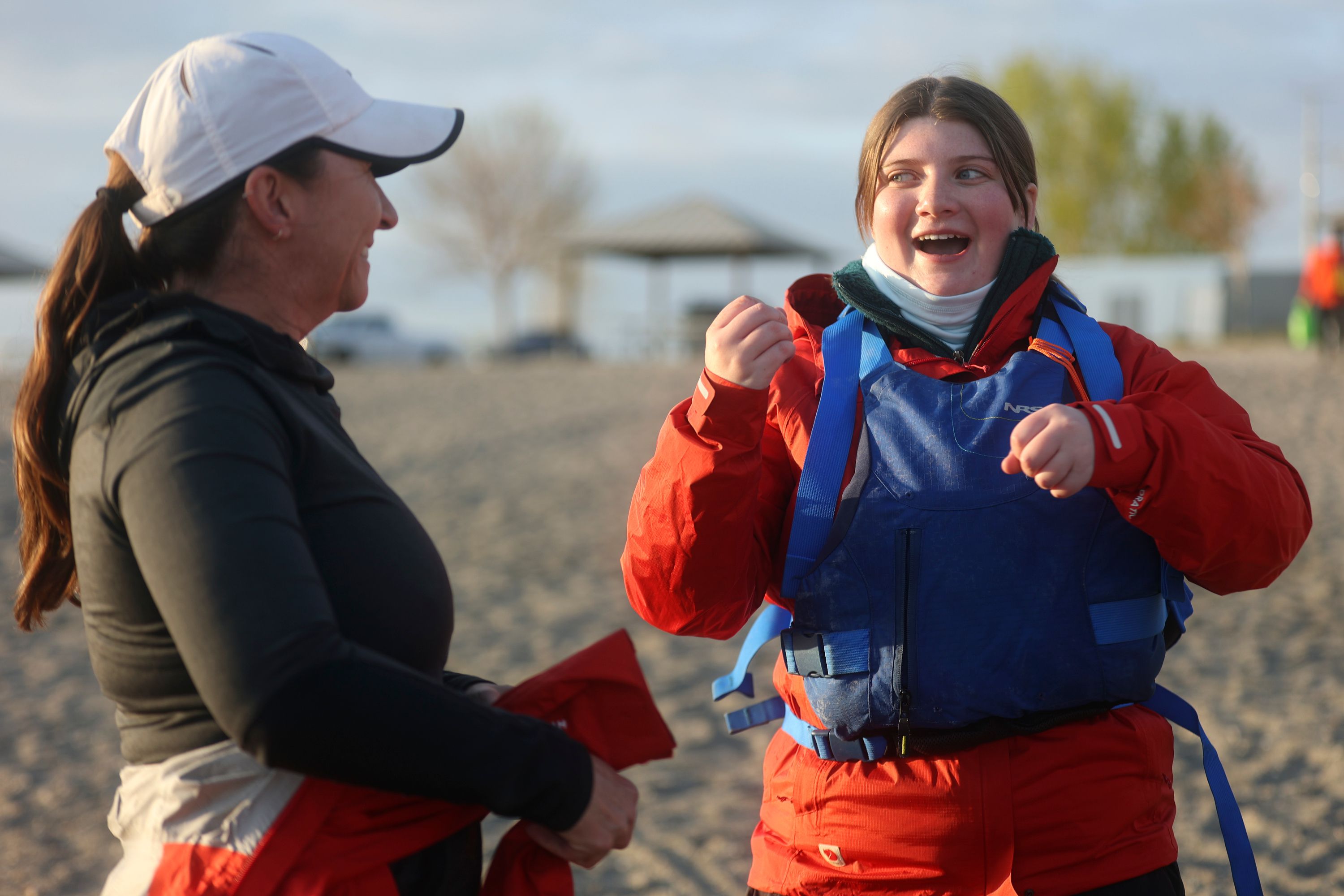 Liz Wood, Utah Schools for the Deaf and the Blind Davis district teacher, and Ashton Hintze, a graduate from the schools, talk about paddling at Pelican Beach in Willard Bay in Willard, Box Elder County, on April 29. Students and faculty from the schools, and some support friends, are doing an overnight paddle mission to train for the SEVENTY48, an upcoming 70-mile boat race between Tacoma and Port Townsend, Wash., that has to be completed in 48 hours. Hintze competed last year, but the team was unable to complete the race due to bad weather. She has returned for redemption, even after graduating.